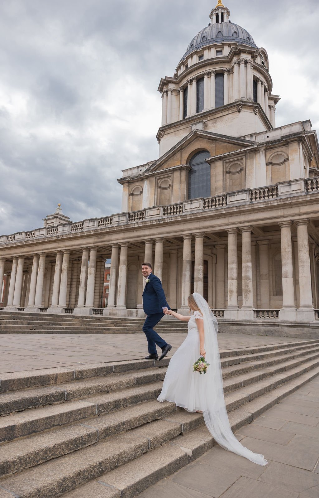 Couple walking through the Old Royal Naval College near the  Queen’s House Greenwich