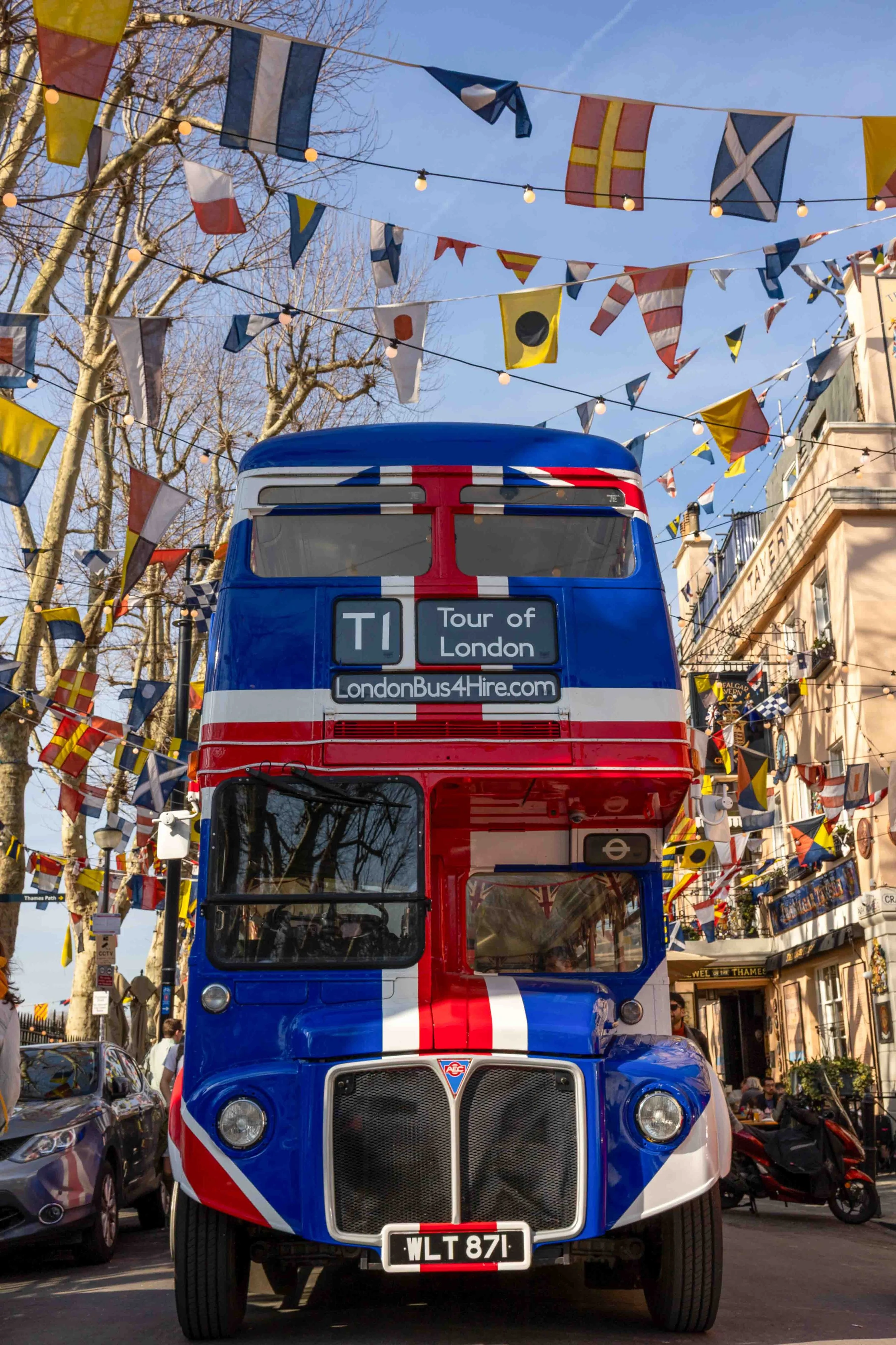 London bus decorated with flags near Trafalgar Tavern Greenwich