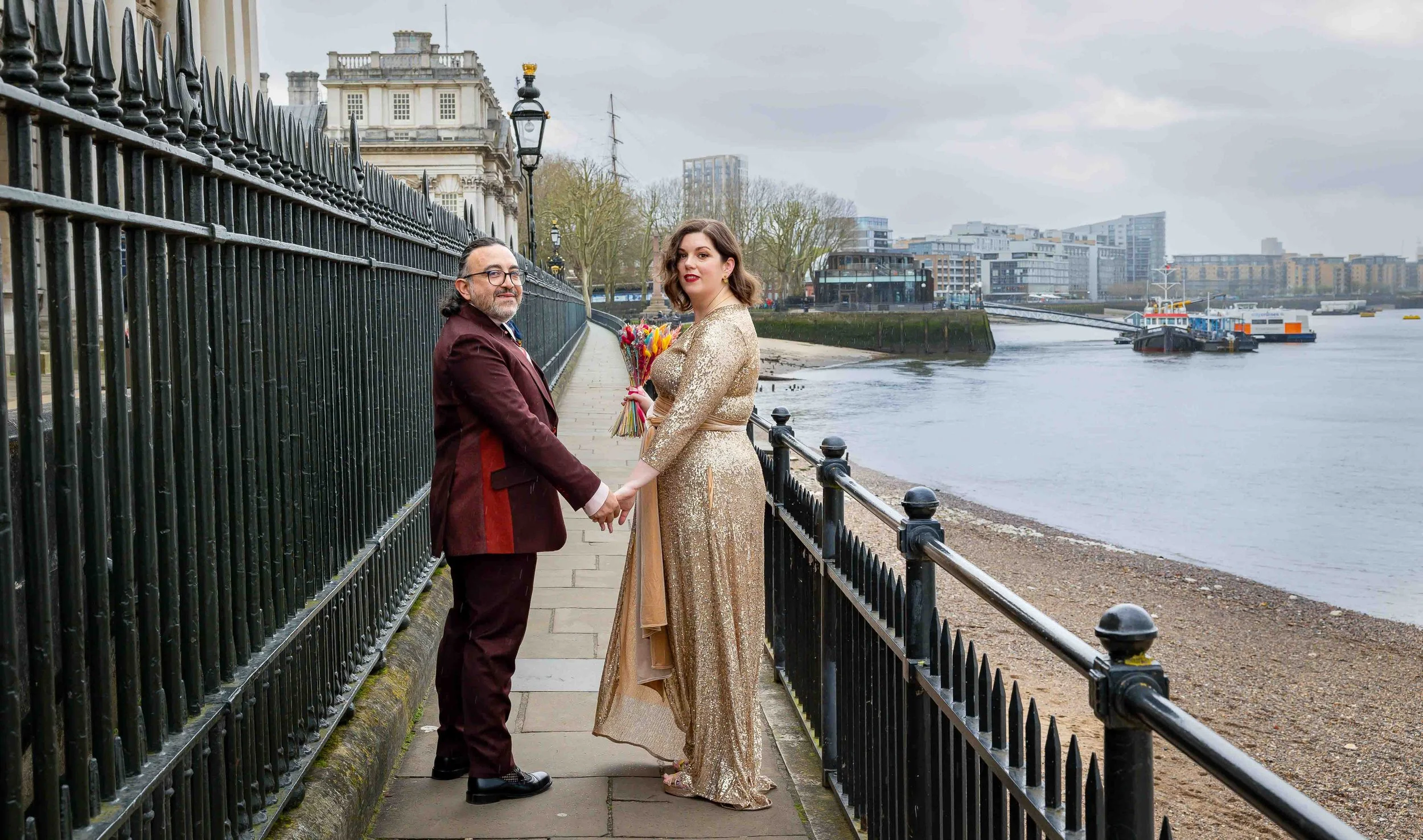 Bride and groom portrait by the Thames near Trafalgar Tavern