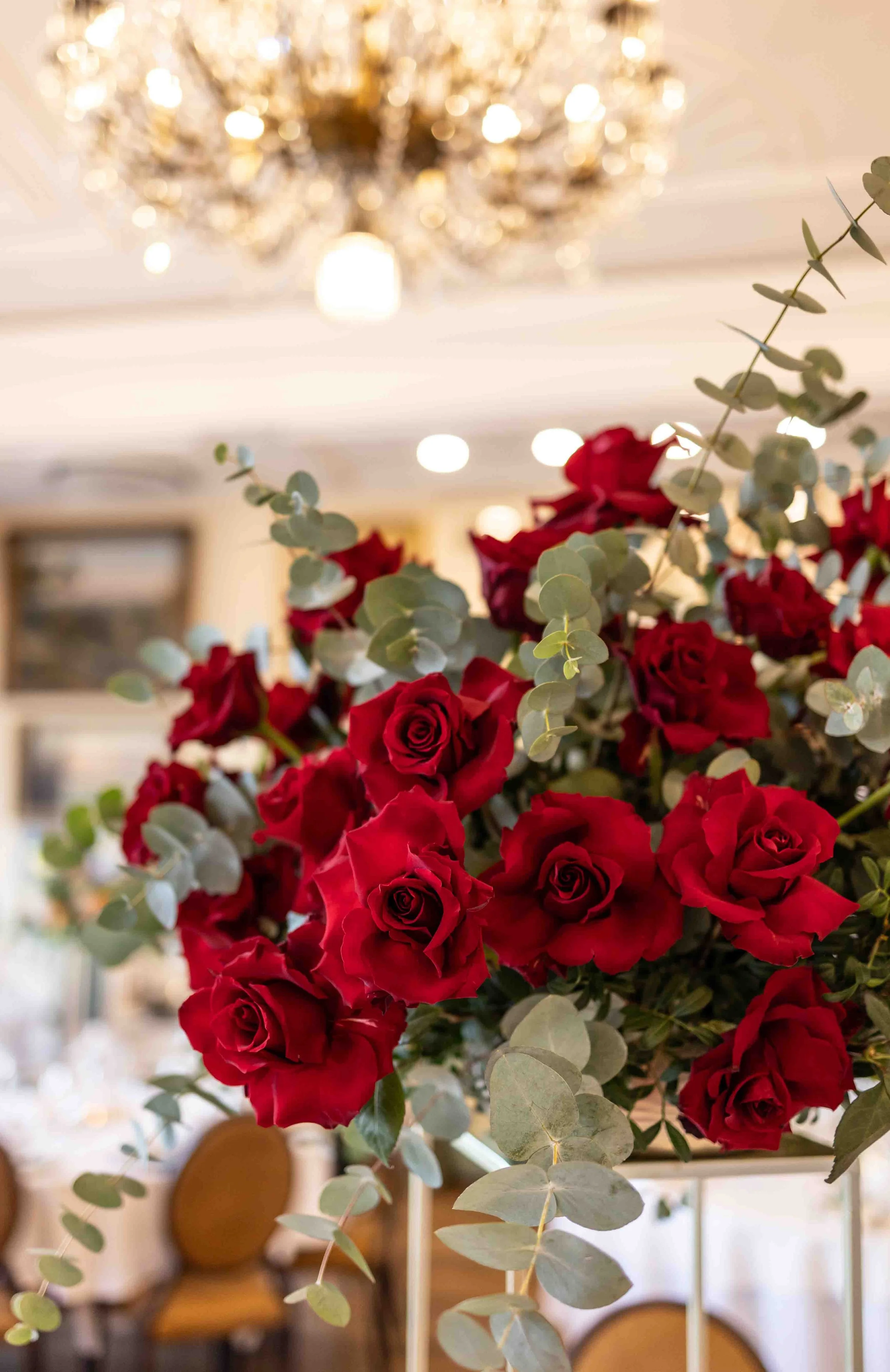 Red rose bouquet detail at Trafalgar Tavern wedding reception