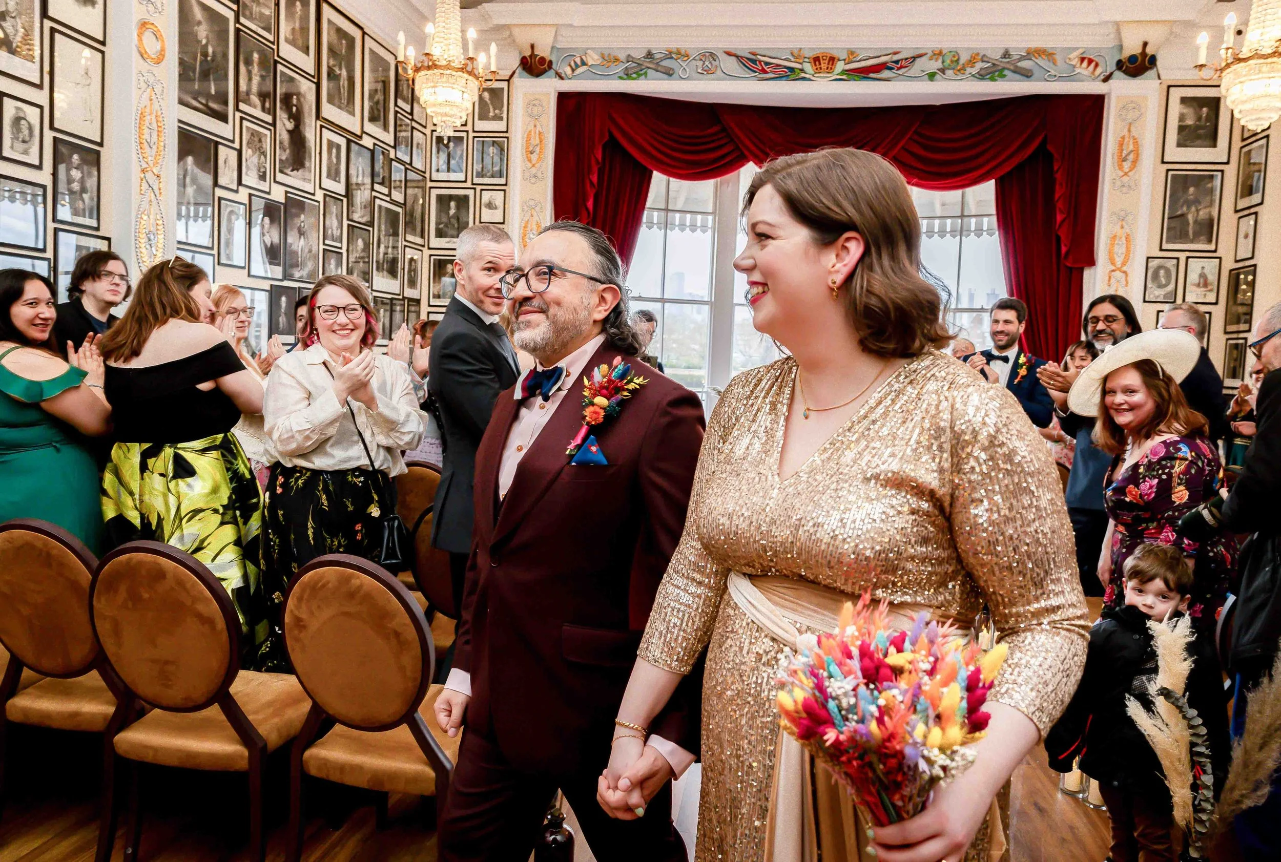 Couple smiling during wedding ceremony at Trafalgar Tavern