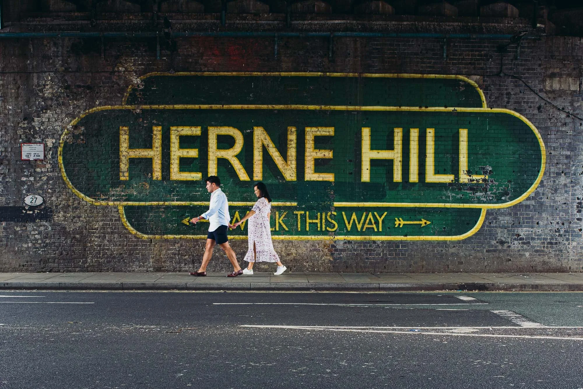 Herne Hill maternity photo session, natural, unposed, documentary style by award-winning London family photographer. Couple walking hand in hand.