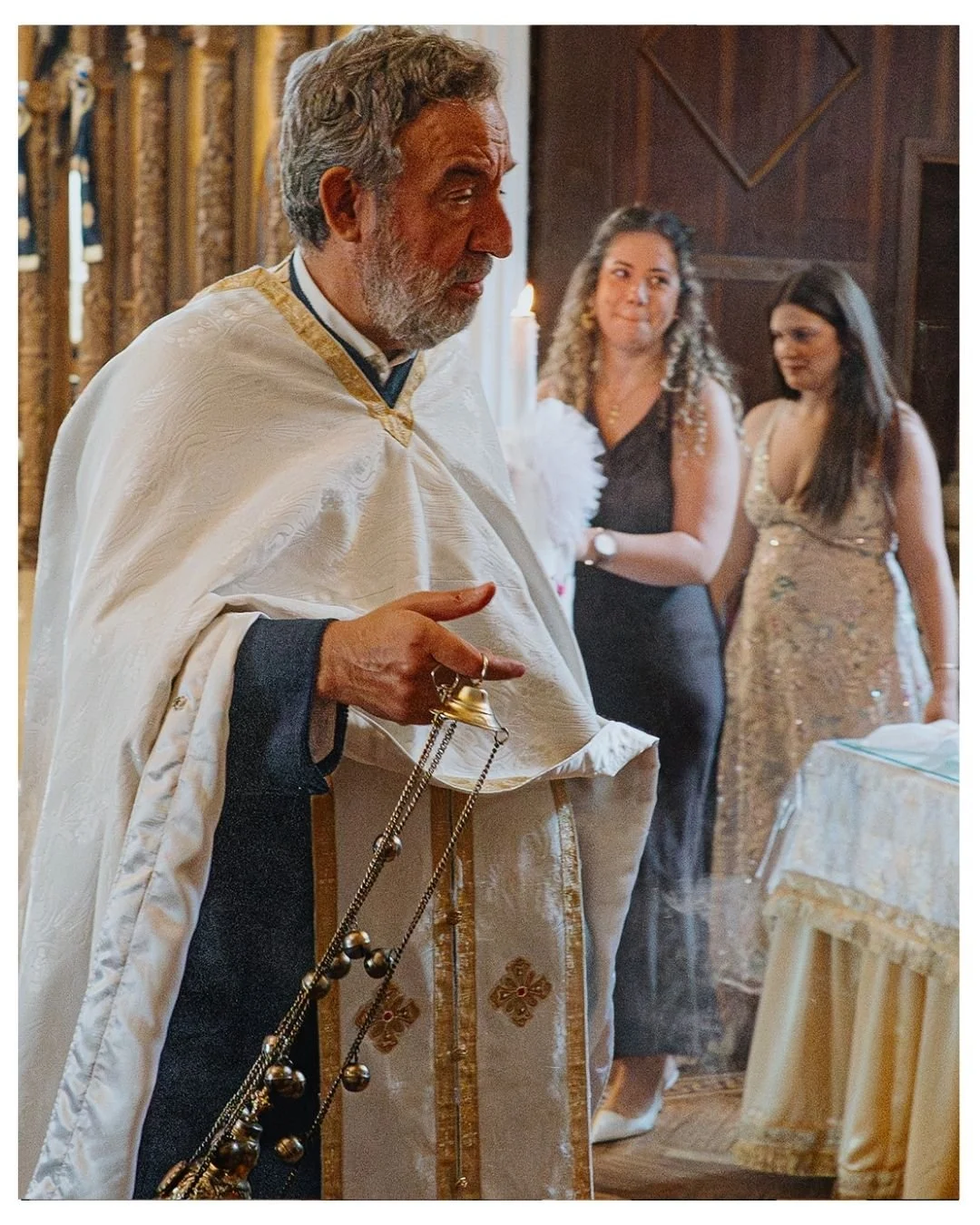Award-winning London Greek Orthodox Baptism photography. priest, ceremony, church.
