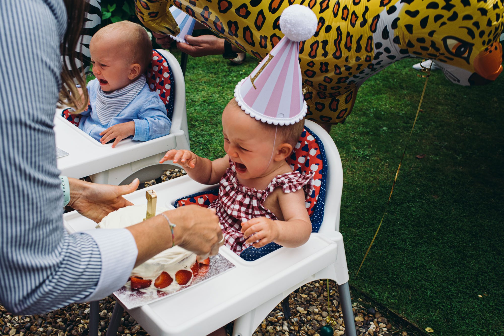 birthday-photographer-party-hat-baby-girl-crying-portrait-family-photographer-brighton-hove-lewes.jpg