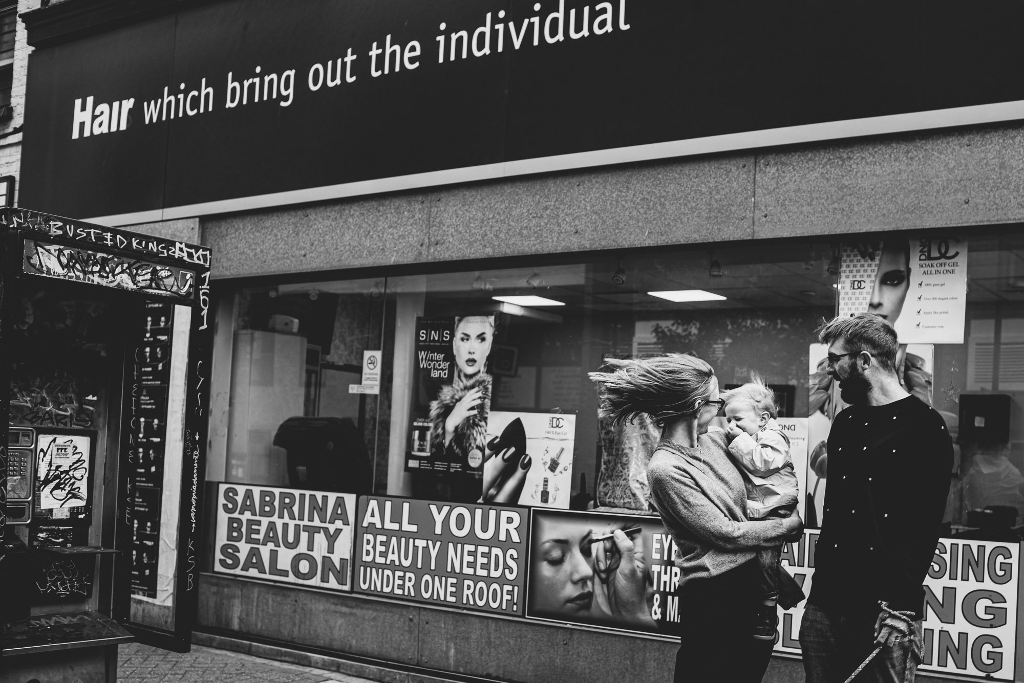 peckham-window-shop-windy-family-portrait-black-and-white-family-photography-london.jpg