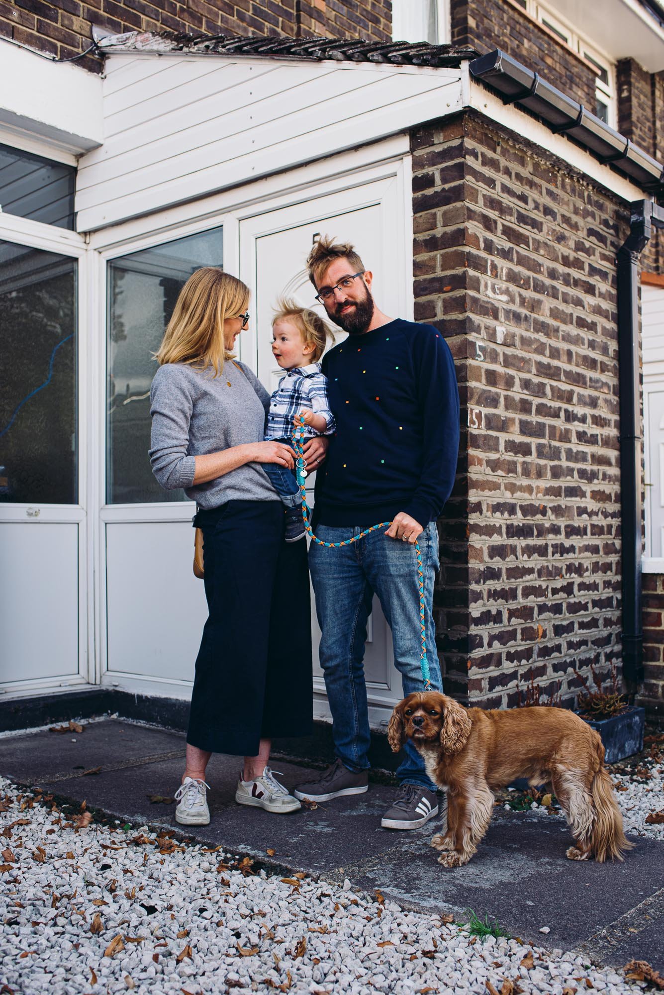 family-portrait-london-photographer-documemntary-style-picture-in-front-of-house-peckham.jpg