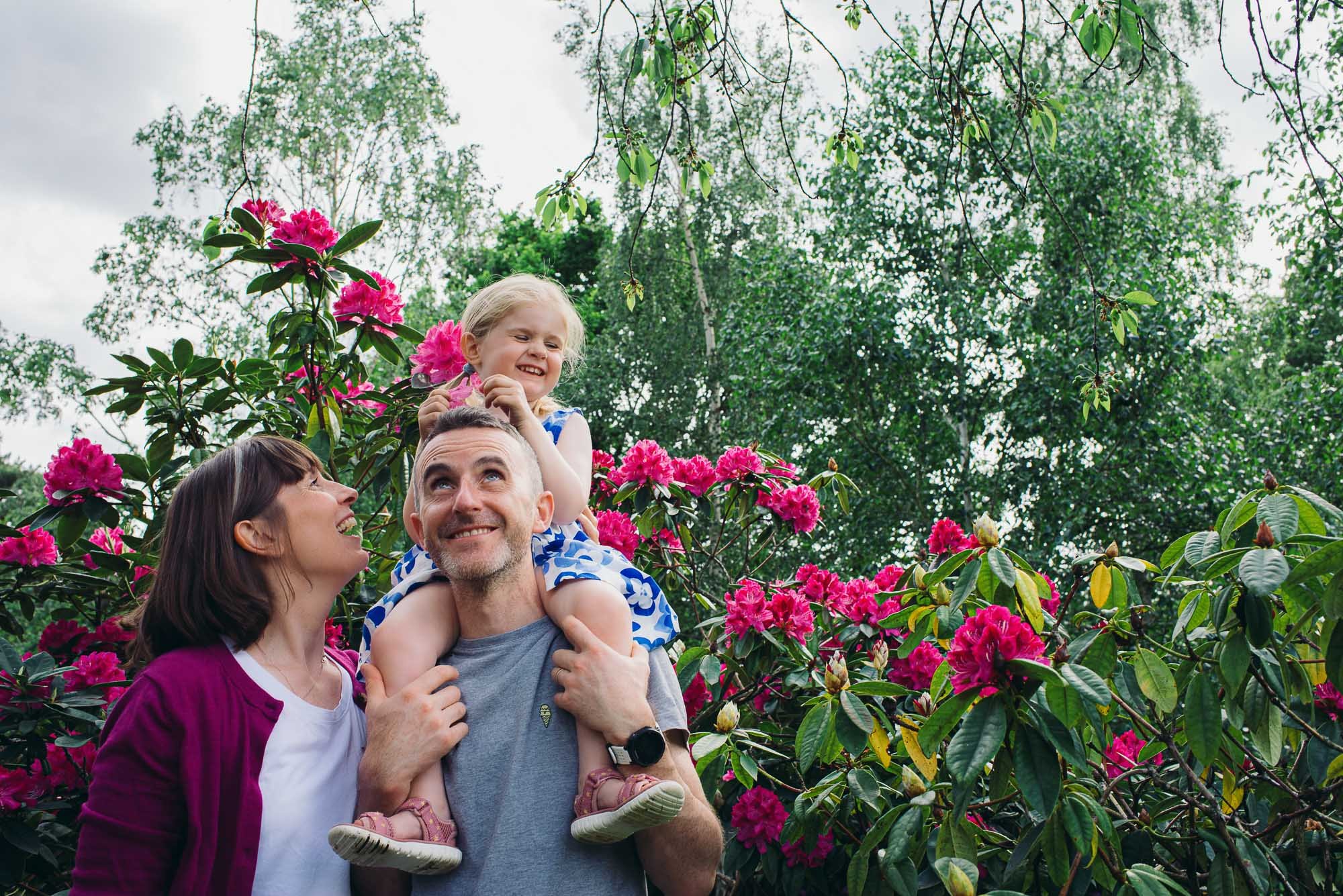 family-portrait-photographer-east-dulwich-dulwich-park-natural-family-photography-pink-flowers-happy-family.jpg