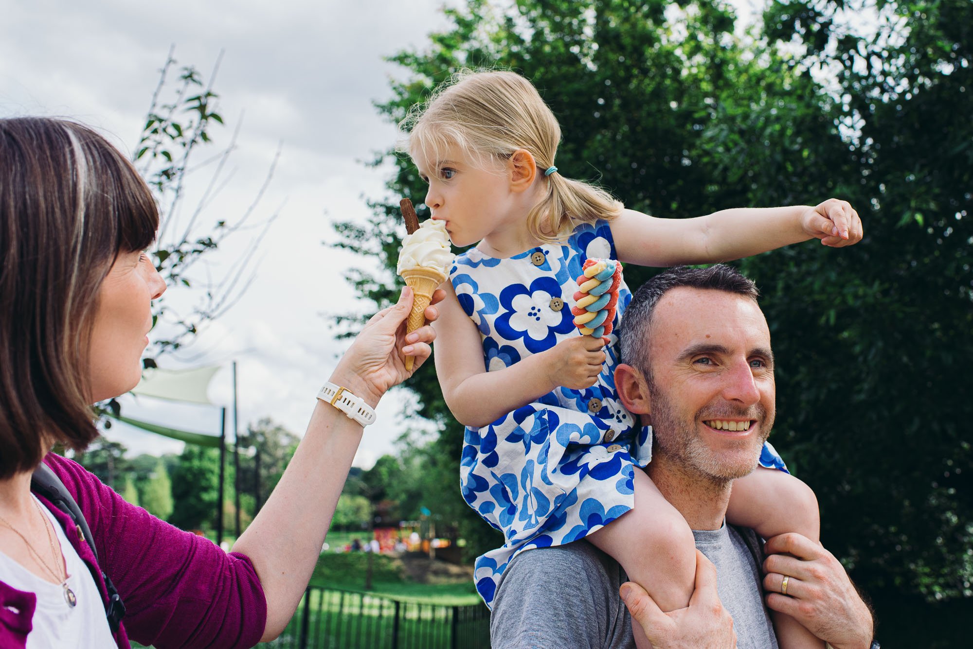 unposed-family-photography-east-dulwich-girl-eating-an-icecream-family-portrait-dulwich-park.jpg