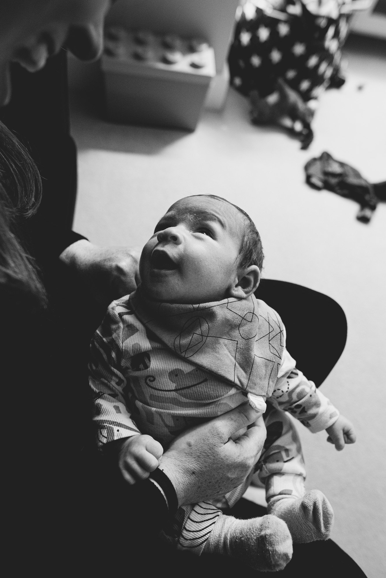 baby-black-and-white-portrait-looking-at-mother-unposed-baby-photography-sussex-brighton-worthing-hove.jpg
