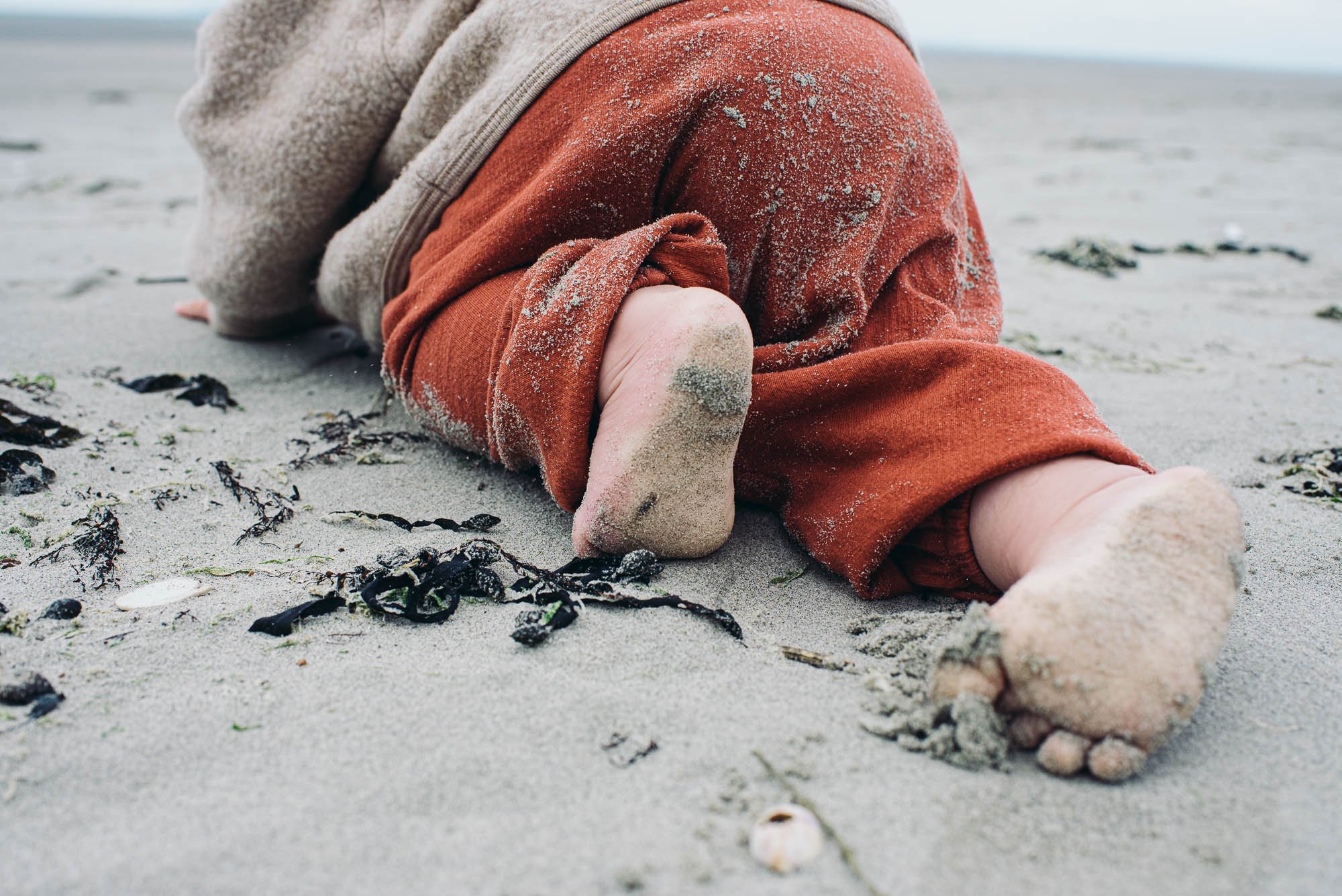 toddler-crawling-in-sand-west-wittering-beach-west-sussex-family-photographer-professional-photo-shoot.jpg