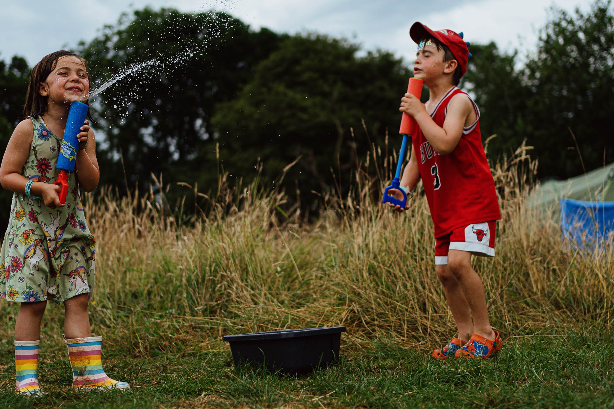 burgess-hill-ditchling-family-photographer-unposed-girl-boy-water-gun-fun-campsite-in-sussex.jpg
