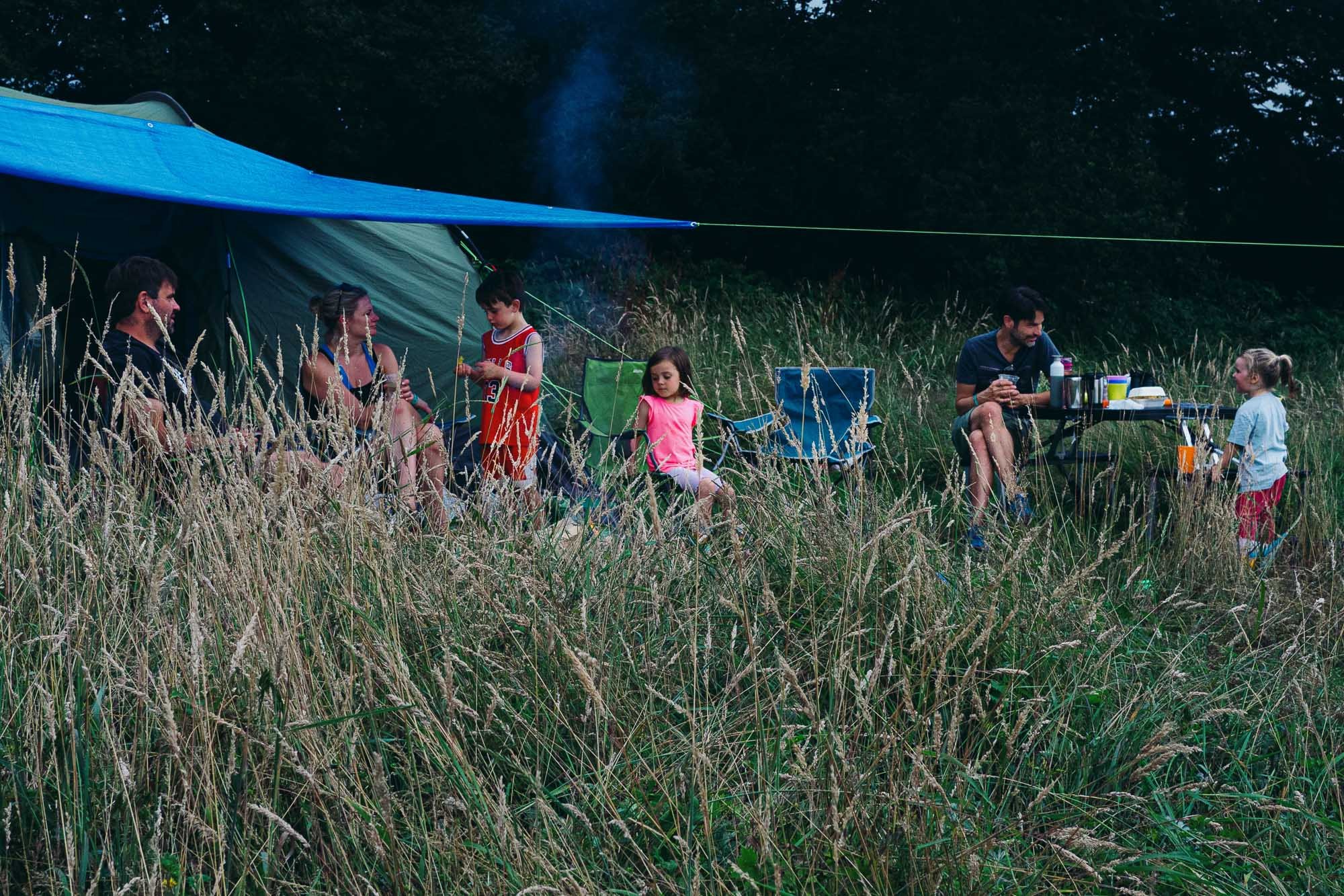 family-photographer-burgess-hill-sussex-documentary-family-photos-campsite-tent-long-grass.jpg
