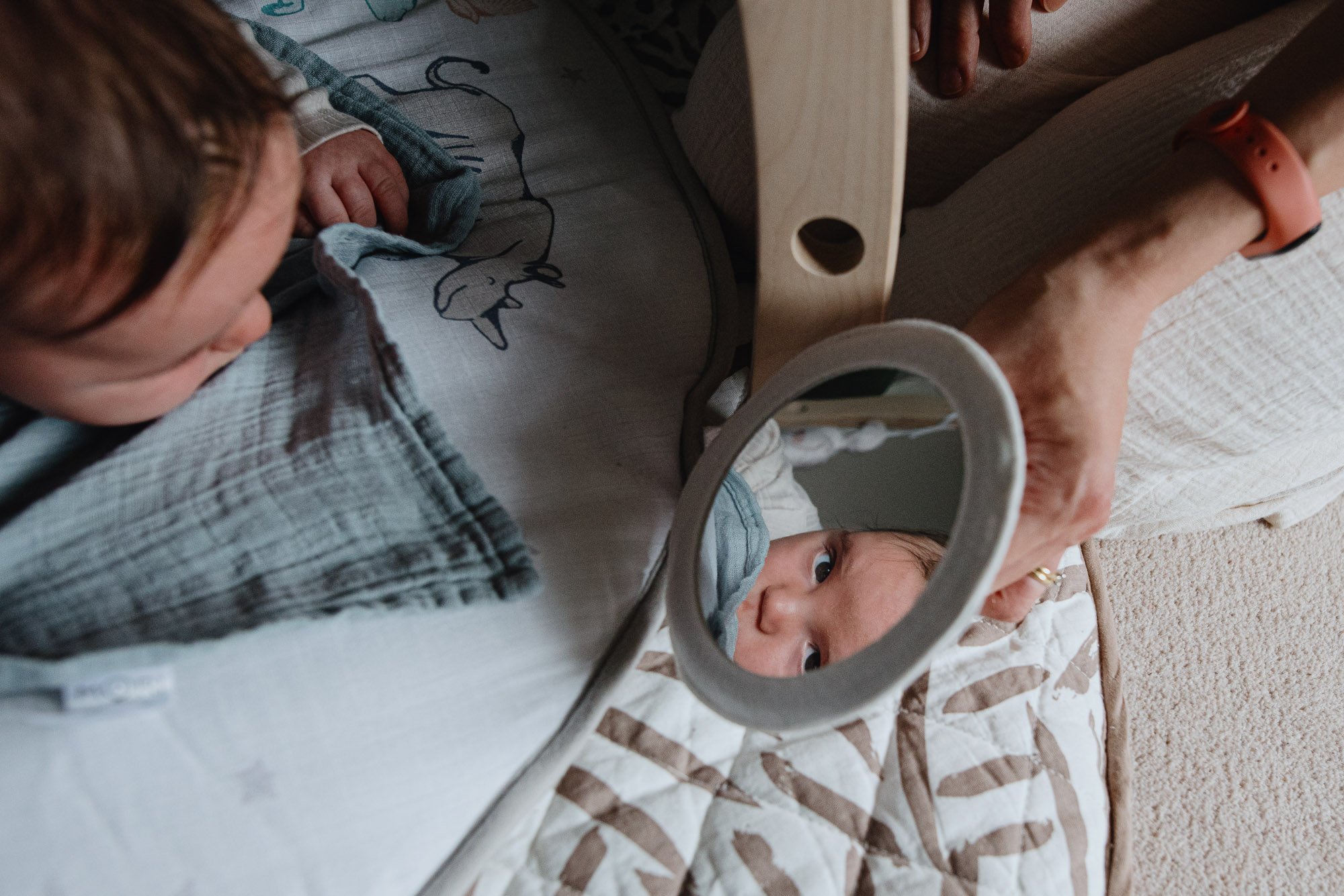 baby-boy-playing-on-play-mat-looking-in-mirror-unposed-natural-newborn-baby-photographer-london.jpg