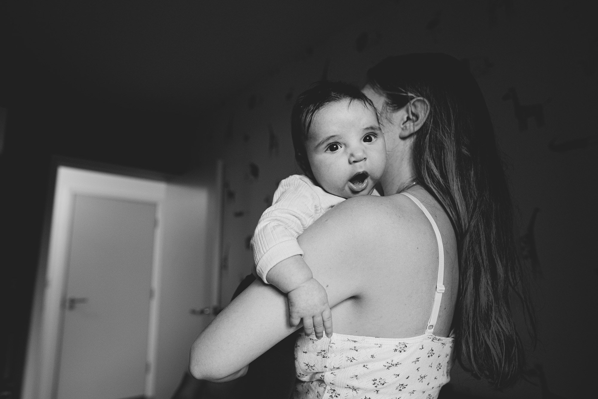 east-london-newborn-photographer-baby-boy-mums-shoulder-at-home-newborn-photography-blach-and-white.jpg