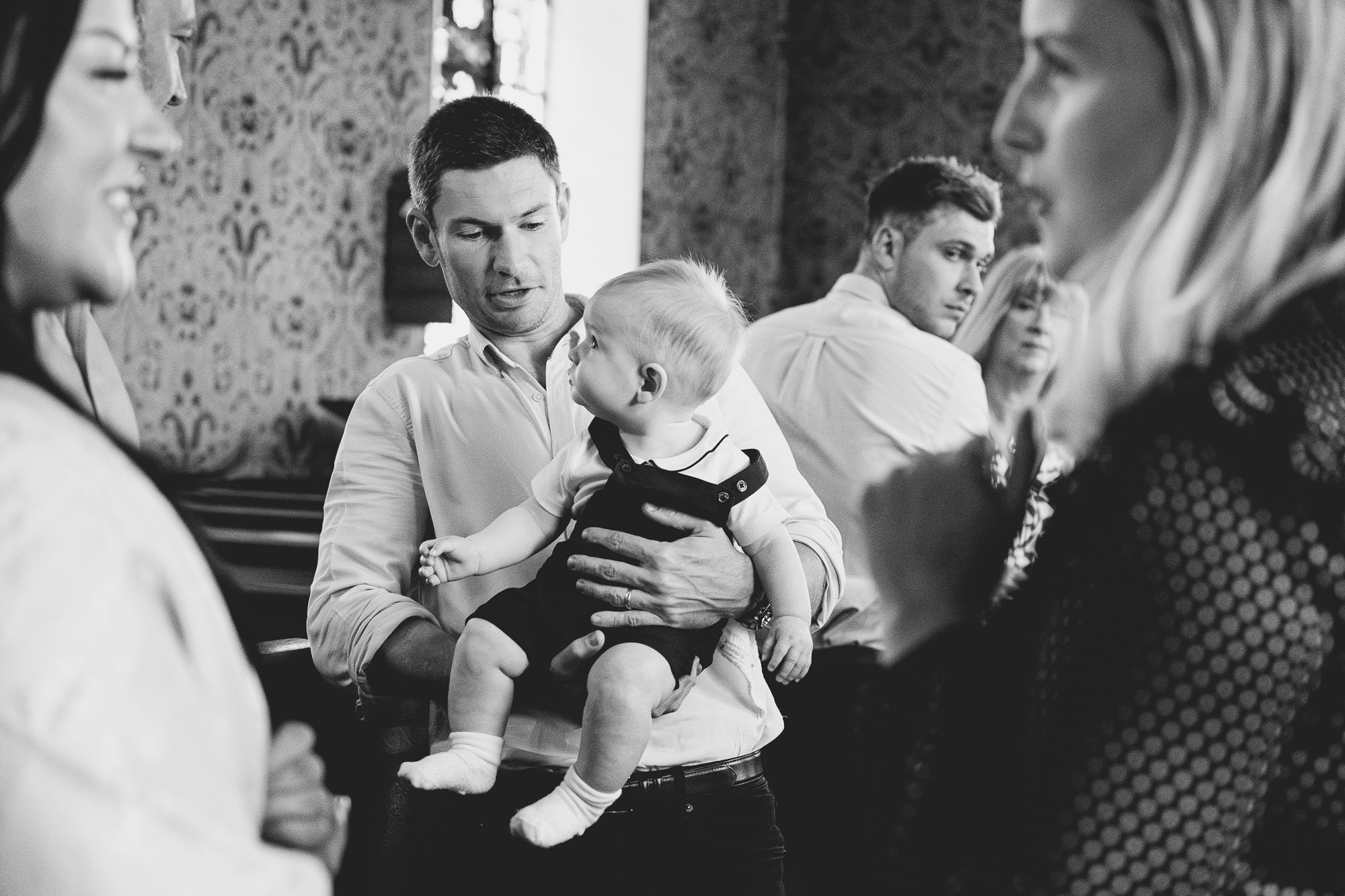 dad-son-christening-ceremony-sussex-christening-photography-black-and-white.jpg