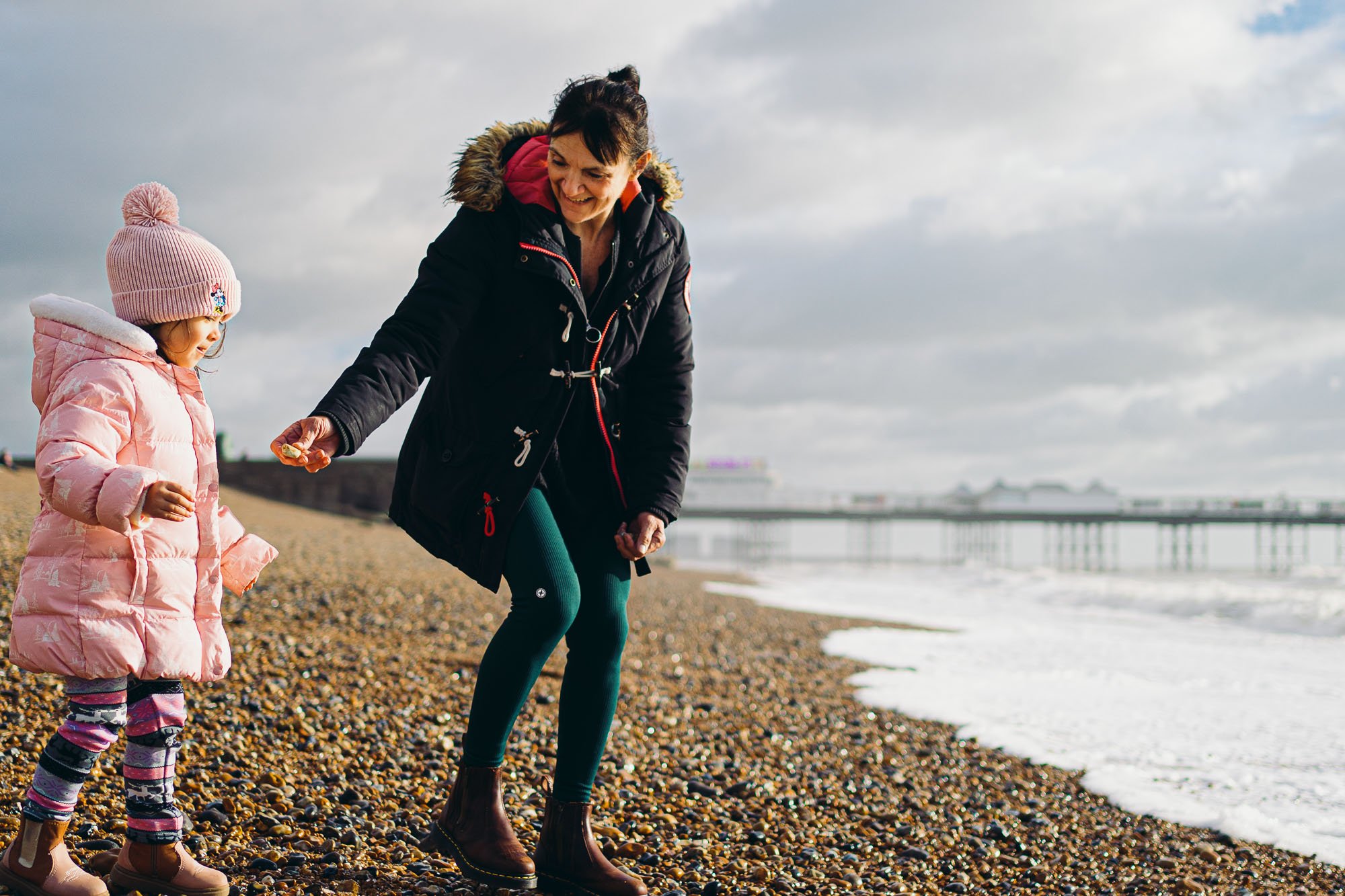 girl-with-grandmother-at-brighton-beach-photo-shoot-family-sussex-family-photographer-natural-unposed-family-photography-worthing-lewes-lancing-eastbourne-horsham.jpg