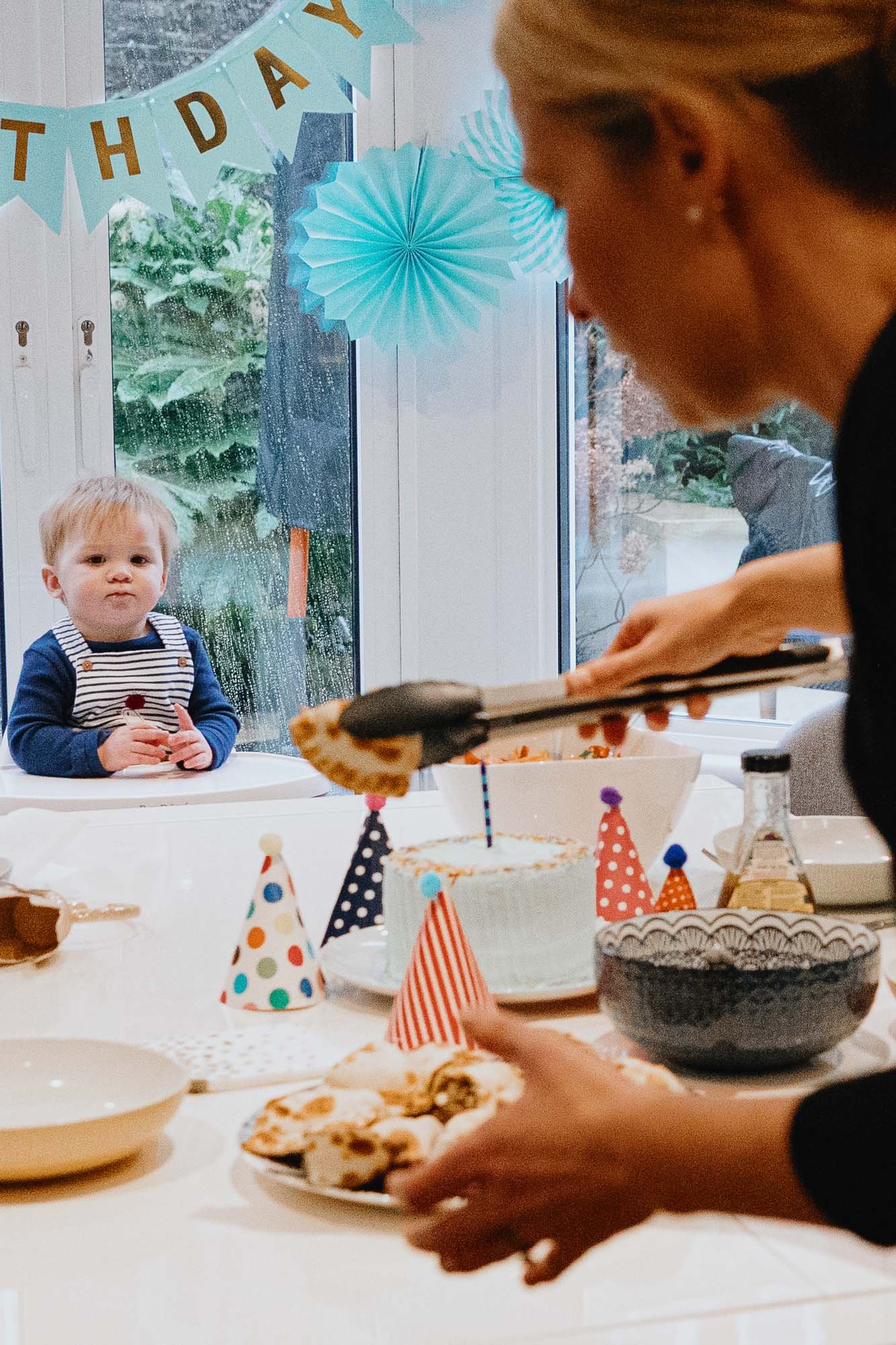 birthday-party-children-photographer-at-home-birthday-natural-unposed-family-photography-boy-looking-at-empanadas-lunch.jpg