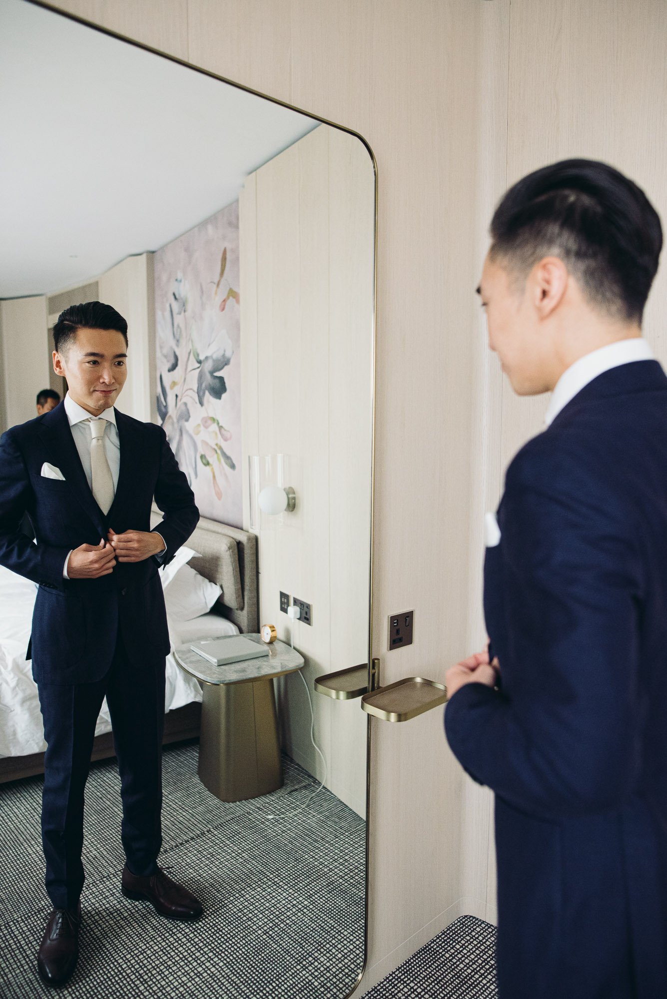 groom-getting-ready-for-big-day-in-hotel-room-documentary-wedding-photographer-brighton-hove-sussex.jpg