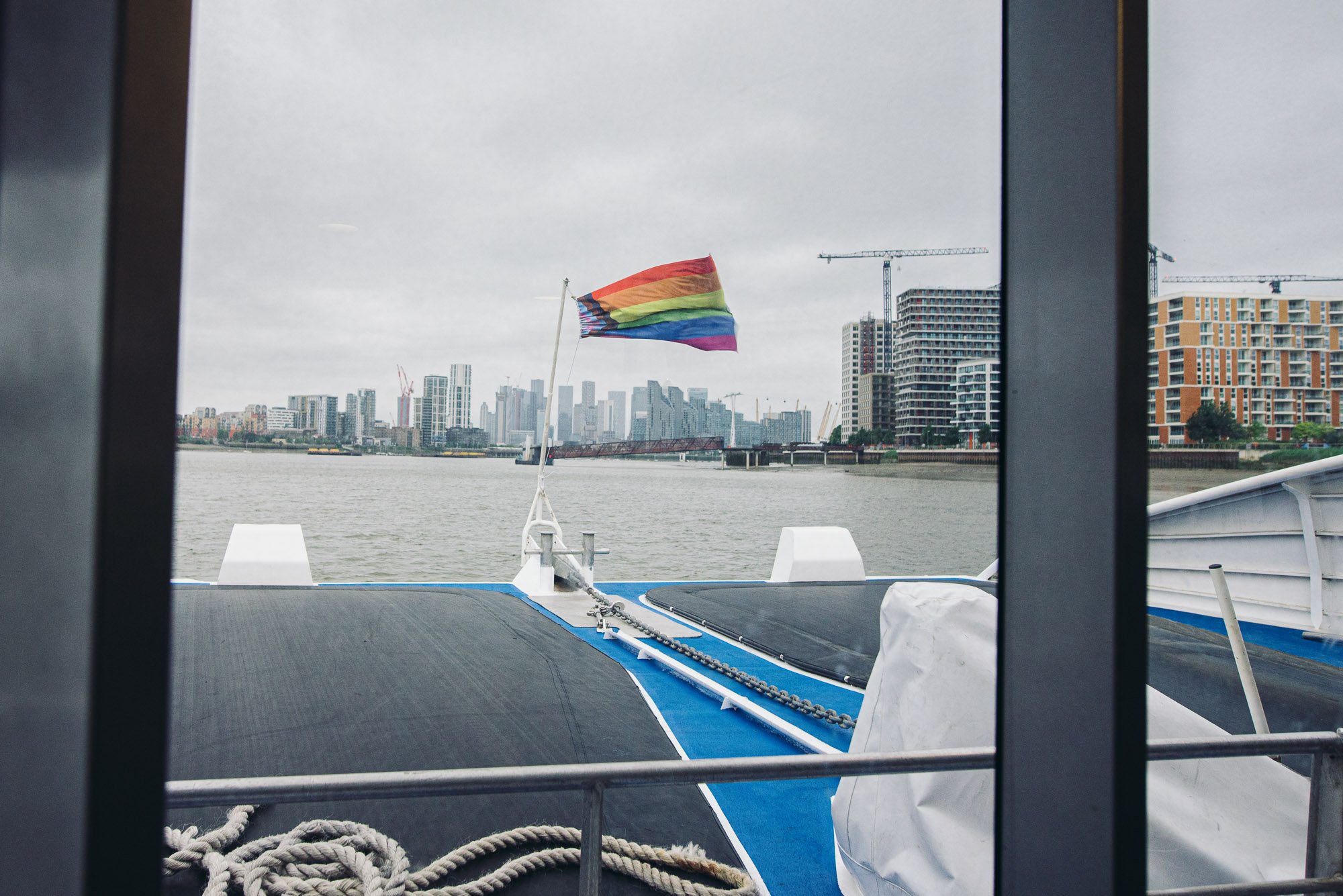 gay-flag-boat-thames-ferry-wedding-documentary-photography-brighton-hove-london.jpg