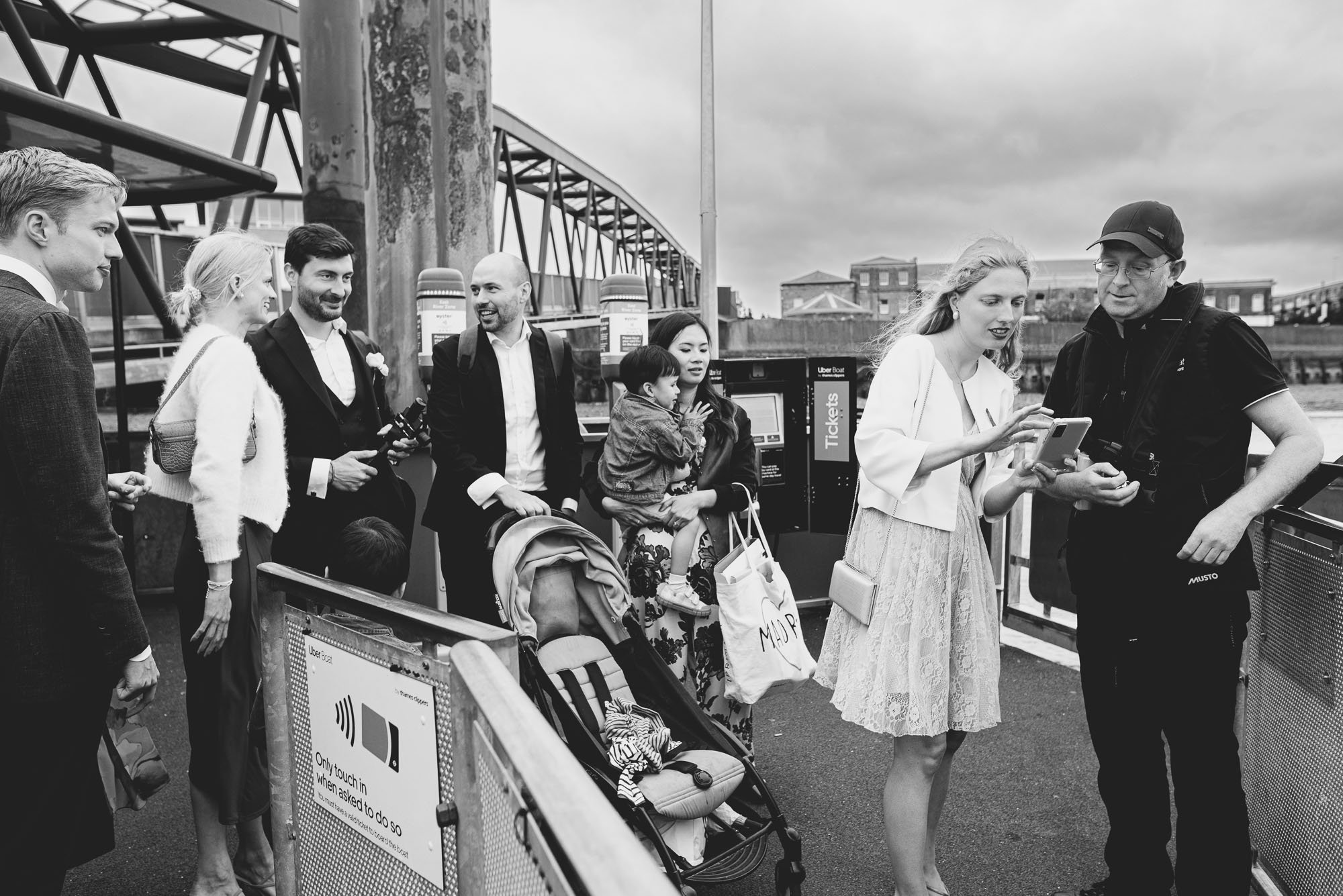 wedding-guests-waiting-for-ferry-uber-documentary-wedding-photography-black-white.jpg