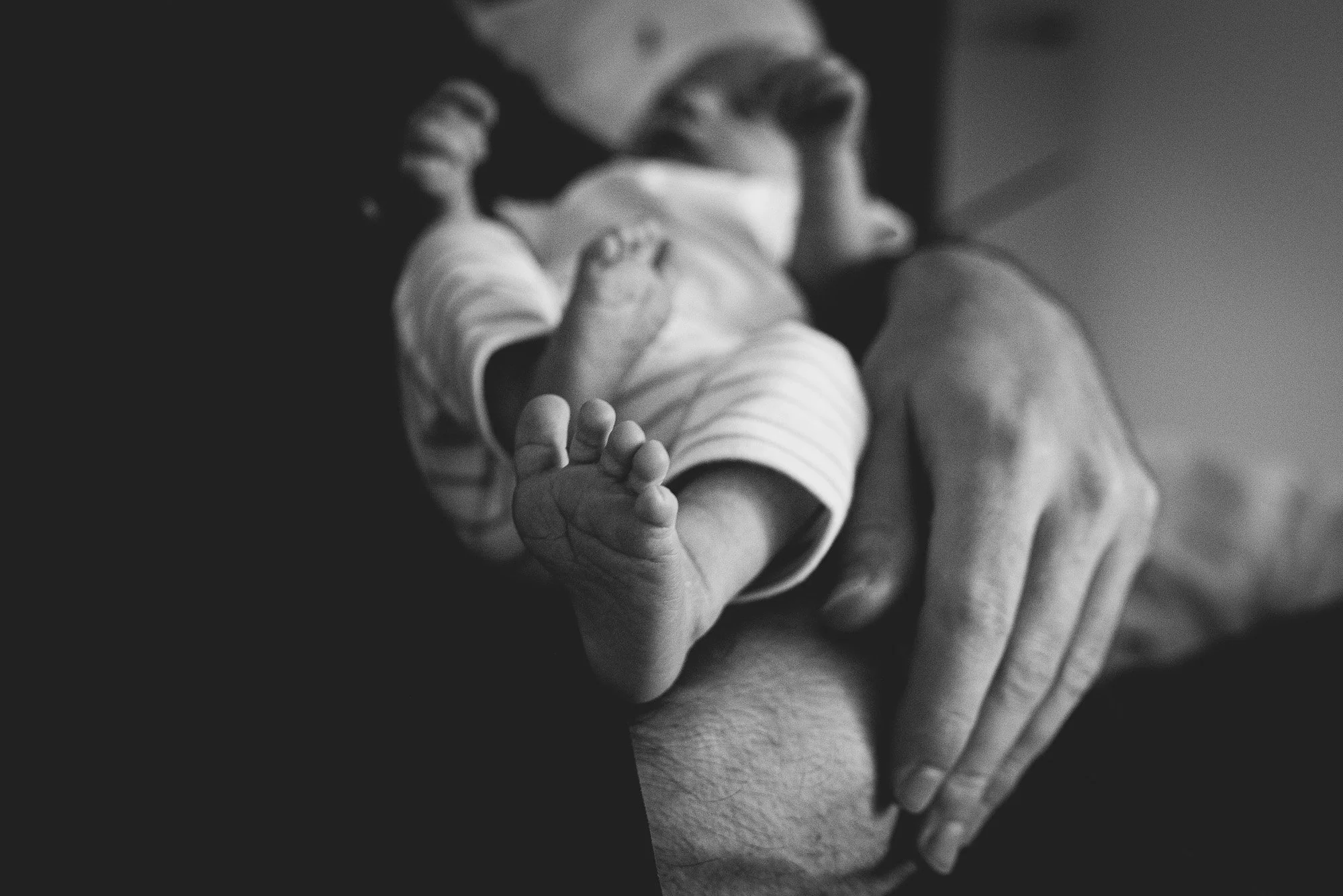 At home newborn photoshoot in Putney, baby's feet, natural, unposed newborn portraits.