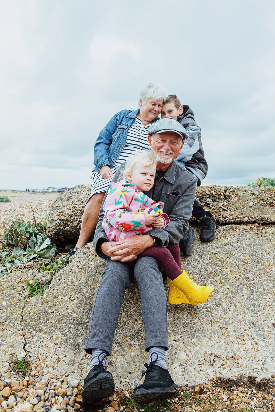 Shoreham beach family photo session with grandparents, portrait taken by award-winning Worthing family photographer.