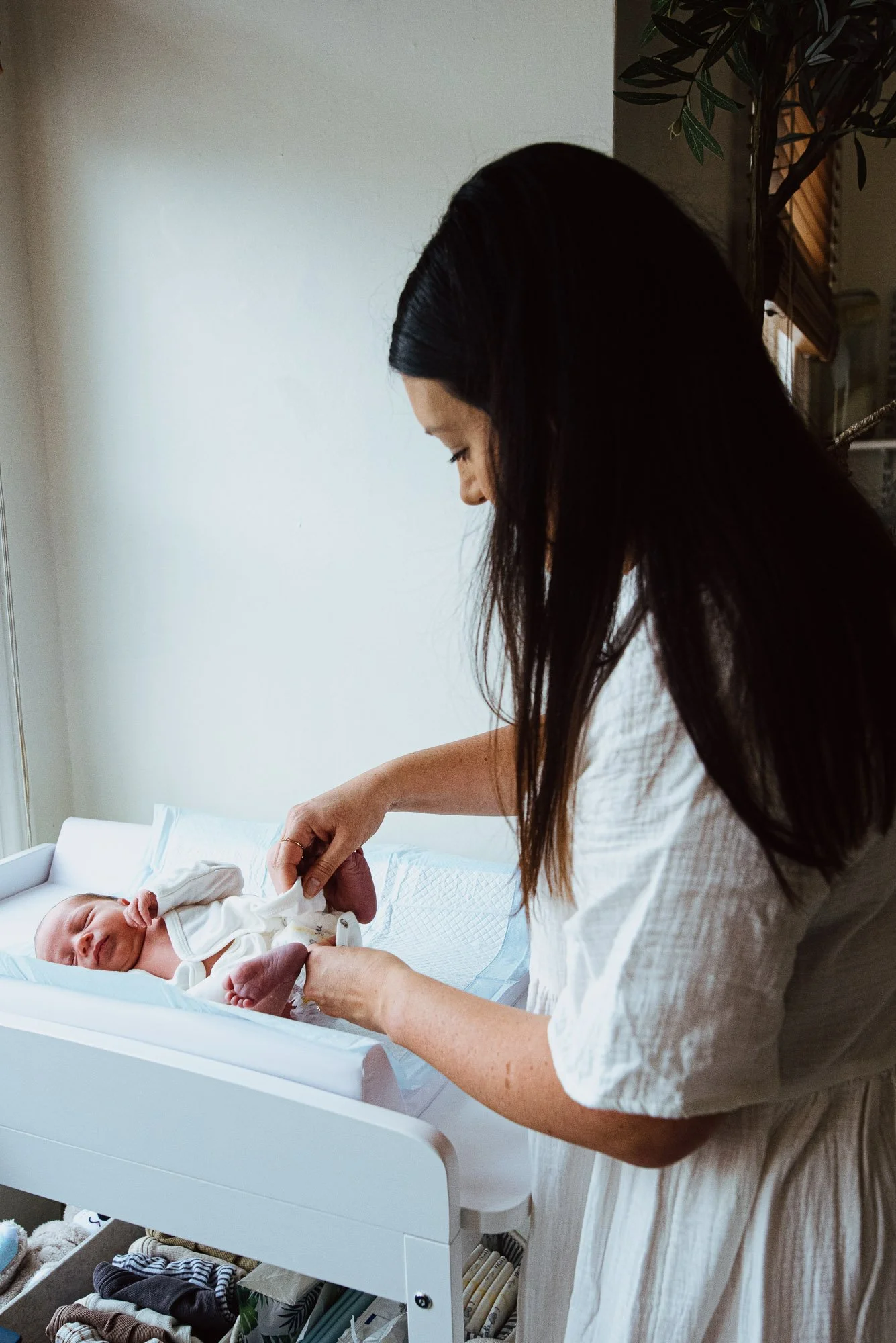 natural-newborn-photography-clapham-tooting-wandsworth-earlsfield-mother-changing-baby-boys-nappy-at-home.jpg