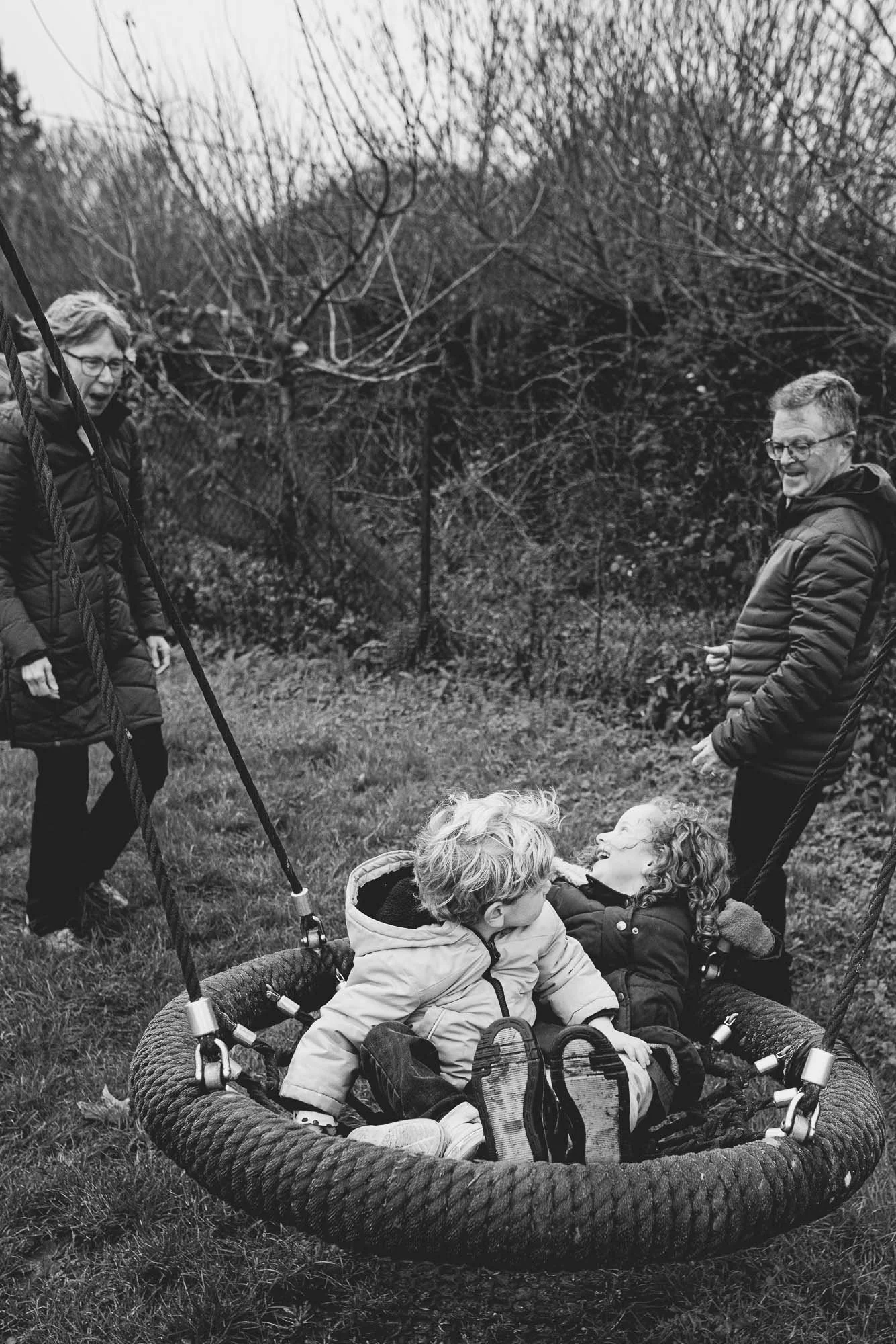 portrait-children-grand-parents-sussex-natural-relaxed-lack-and-white-playground-hassocks-butchers-wood.jpg