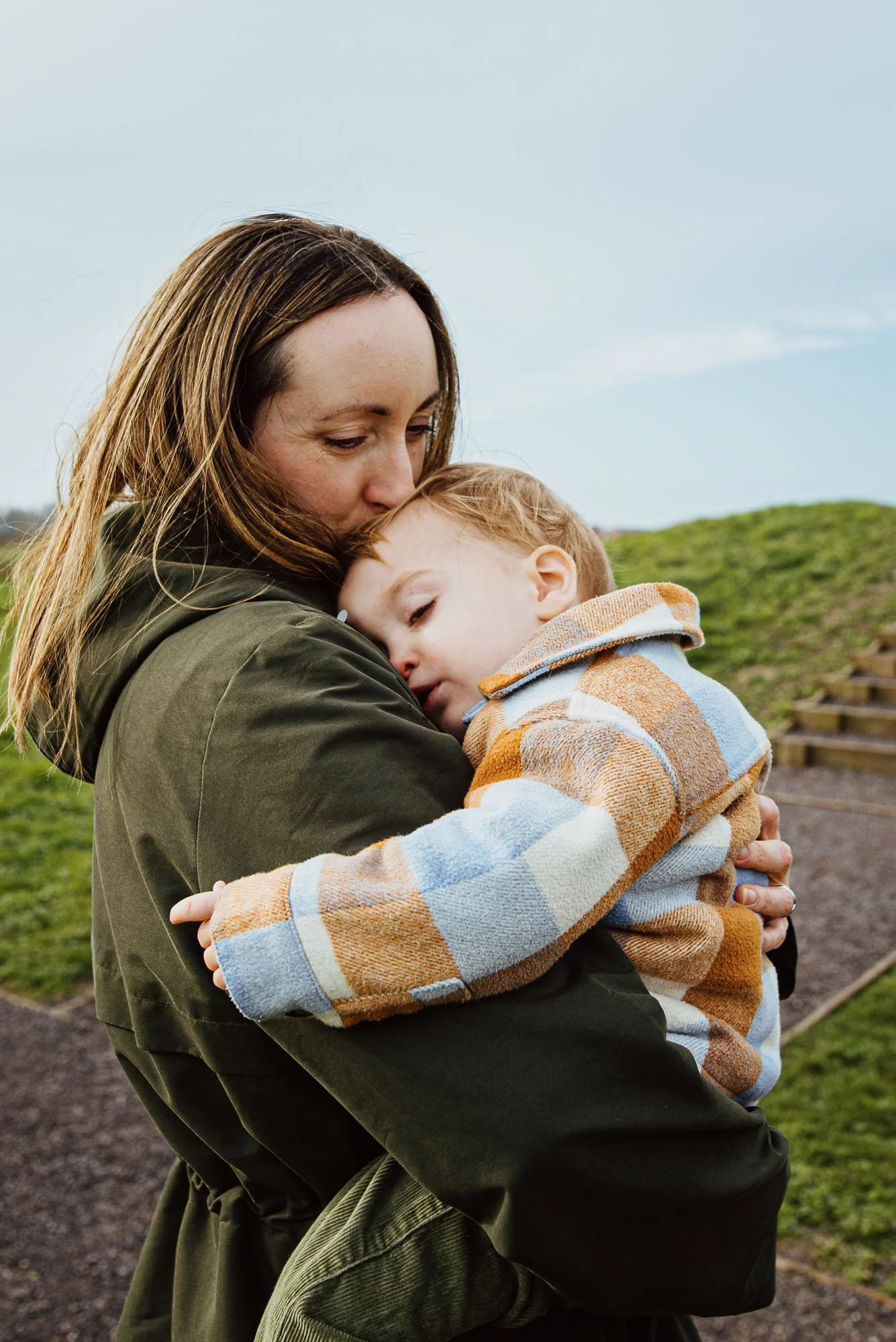 Sussex-family-photography-mother-son-in-arms-outdoors-at-home-family-photos.jpg