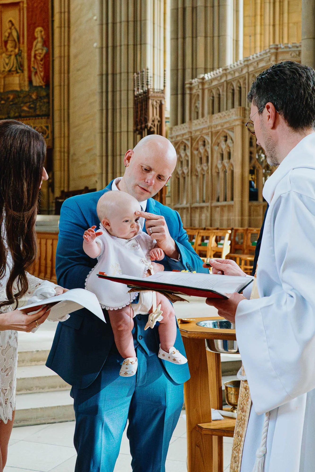 Lancing-christening-photo-ession-Sussex-baby-boy-blessing-priest.jpg