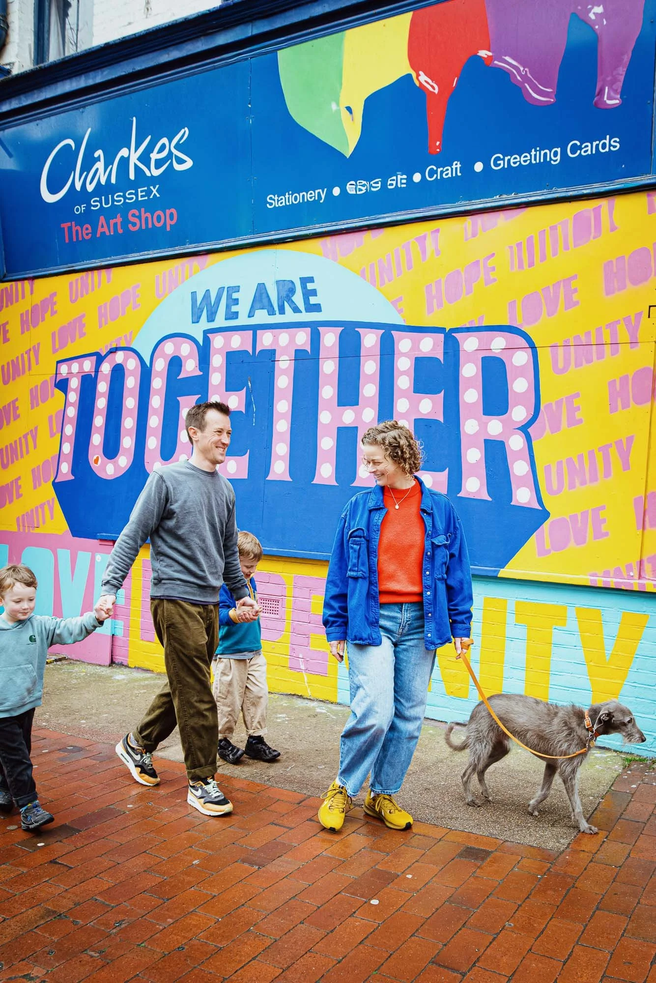 natural-family-photography-susses-brighton-portrait-parents-boys-dog-unposed-north-laine-graffiti-together.jpg