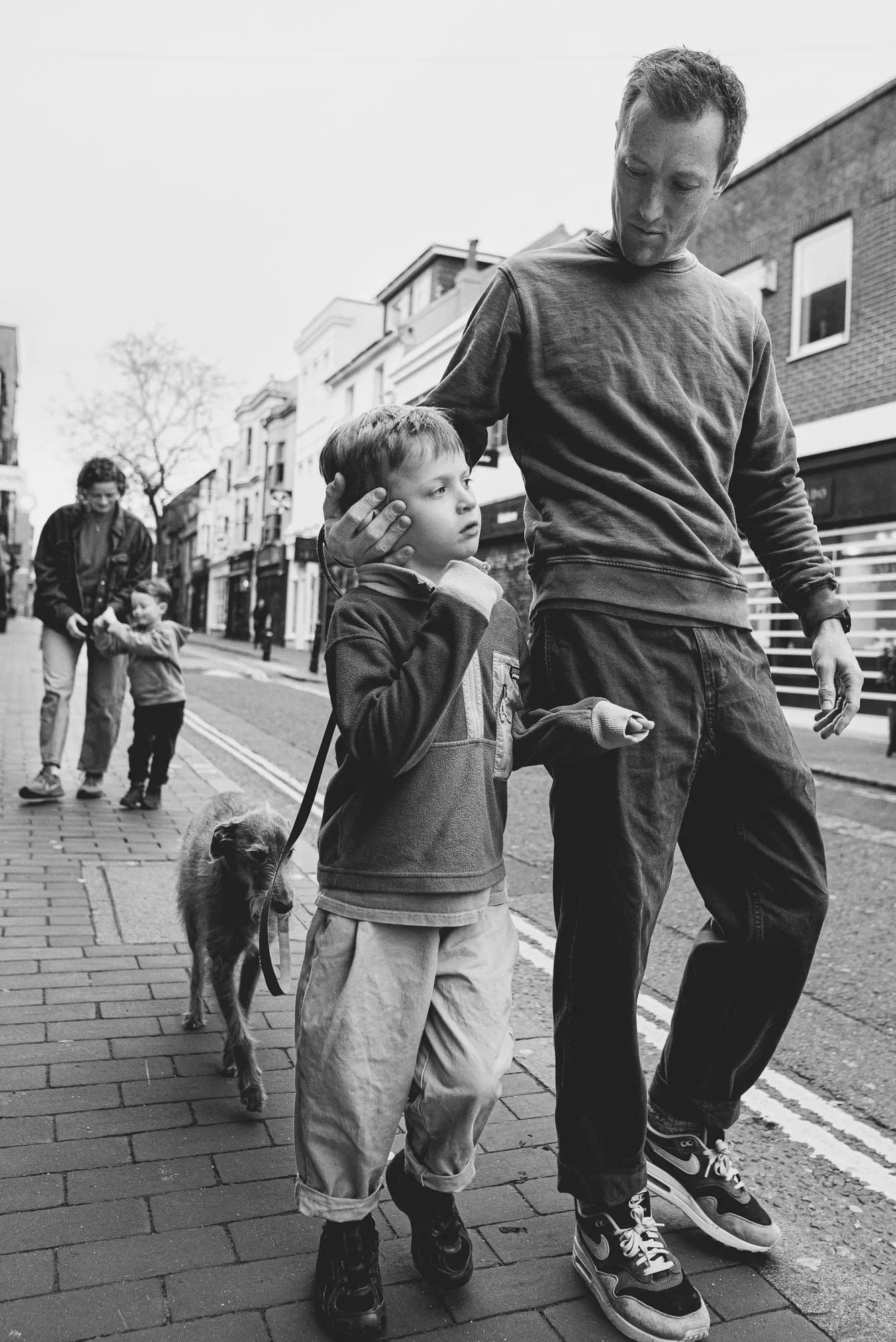 family-portrait-walking-brighton-town-black-and-white-lifestyle-photos-sussex.jpg