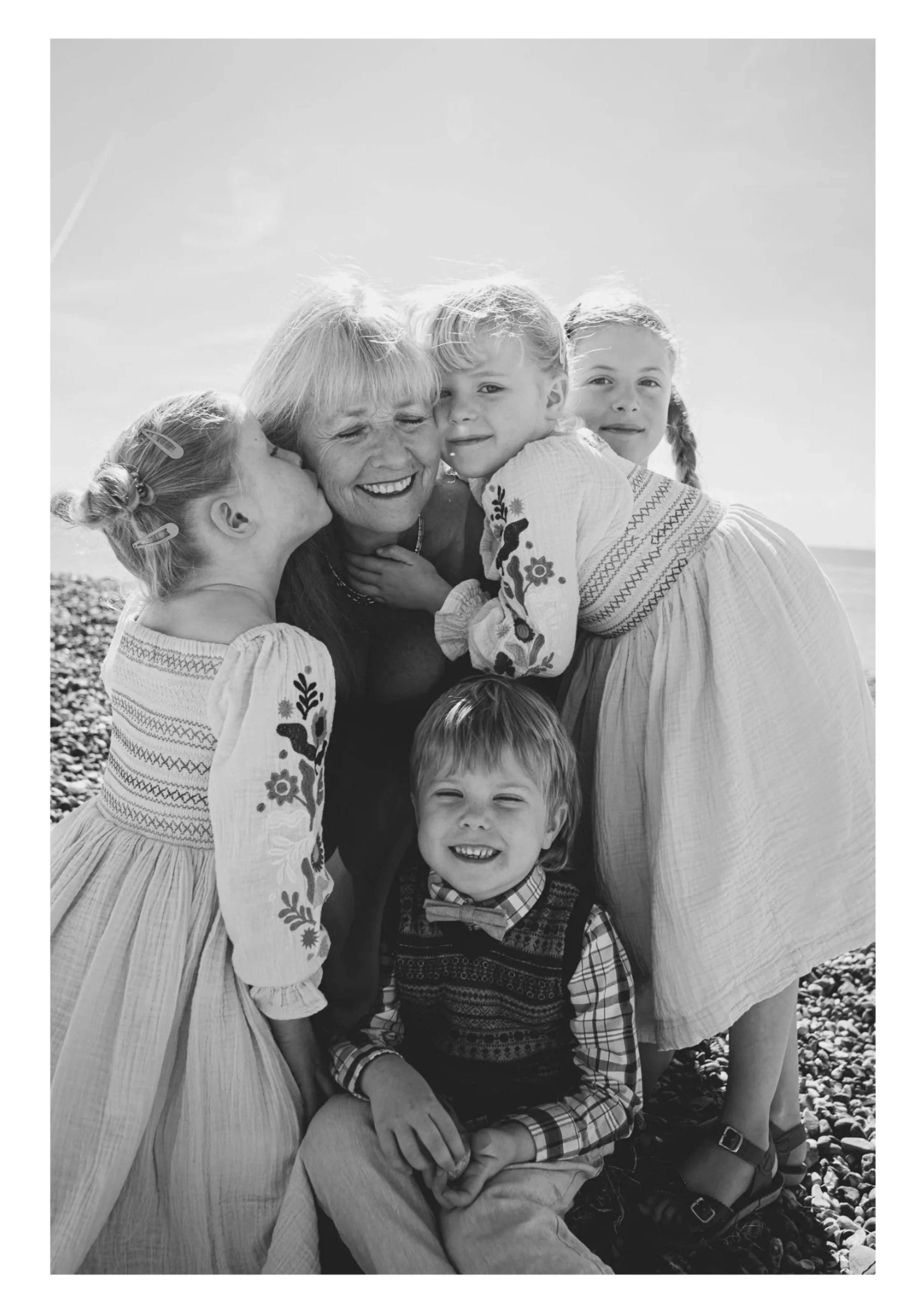 Hassocks family photographer photographing grandmother and her grandchildren at the beach in Sussex, family lifestyle photography in West Sussex.