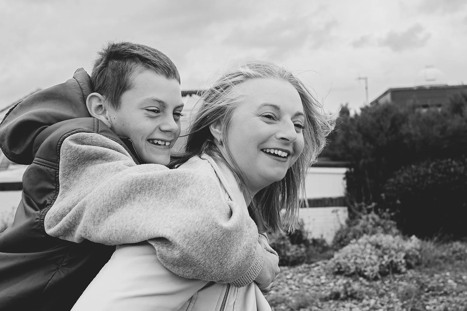 Littlehampton natural family photography, aunt and her nephew during a family photoshoot in the beach in West Sussex.