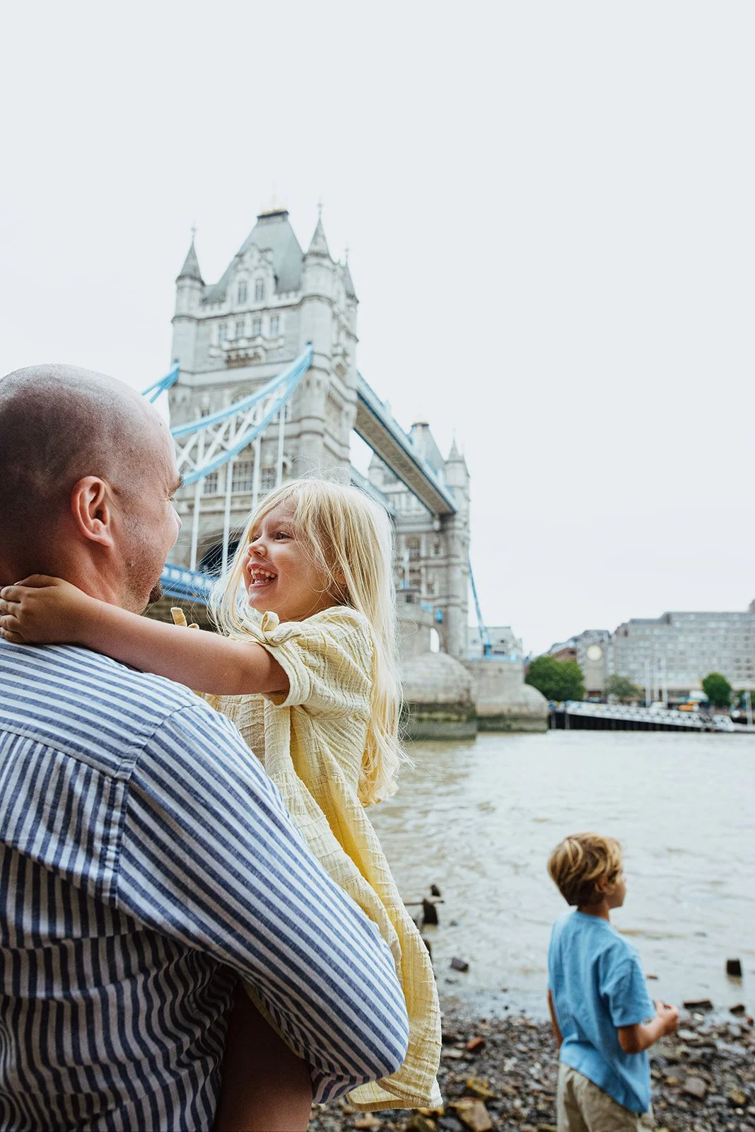 Dad and daughter near the Thames, boy looking at the water, Tower Bridge family photoshoot.