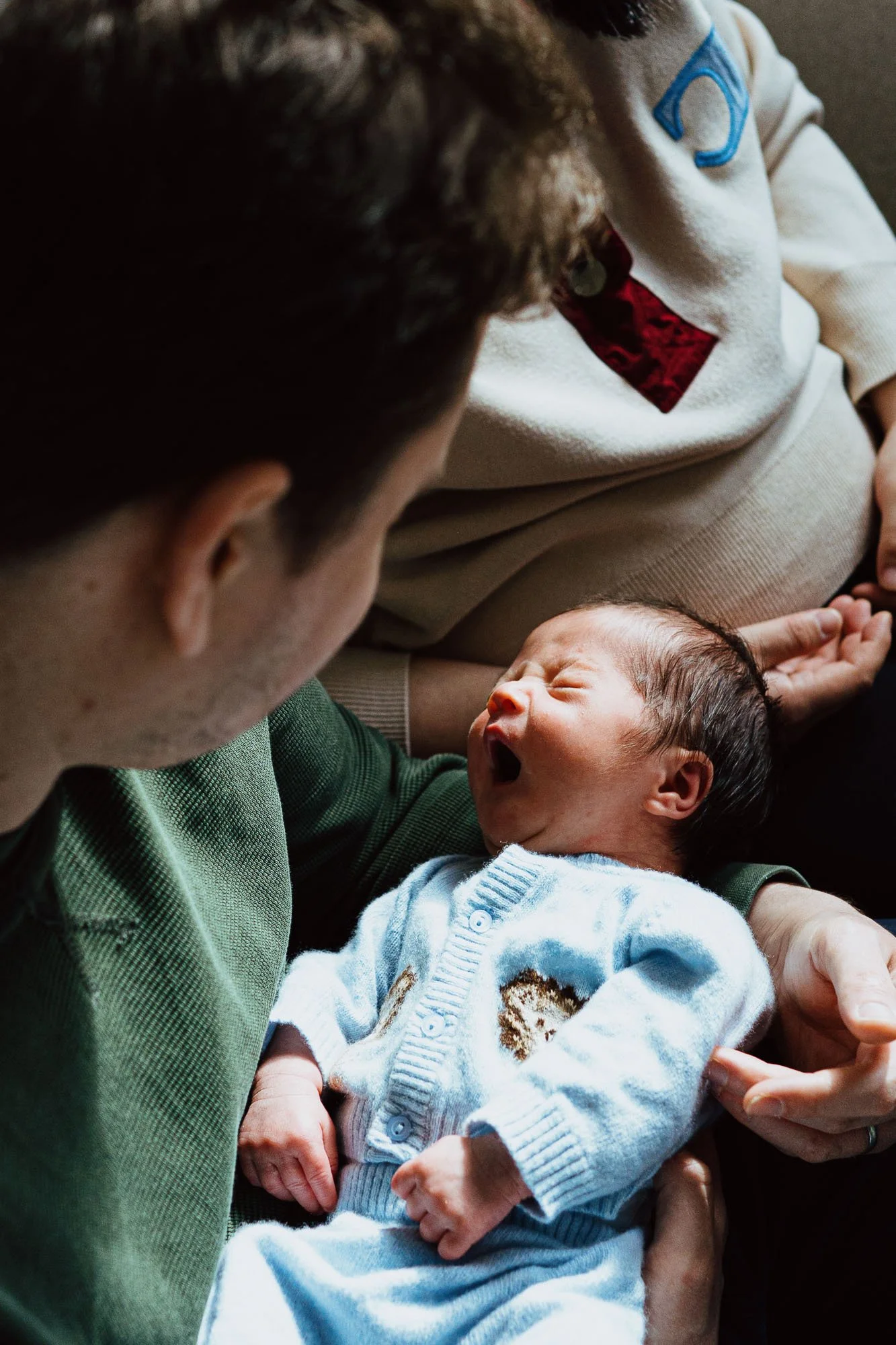 Yawning newborn baby at home in Balham.