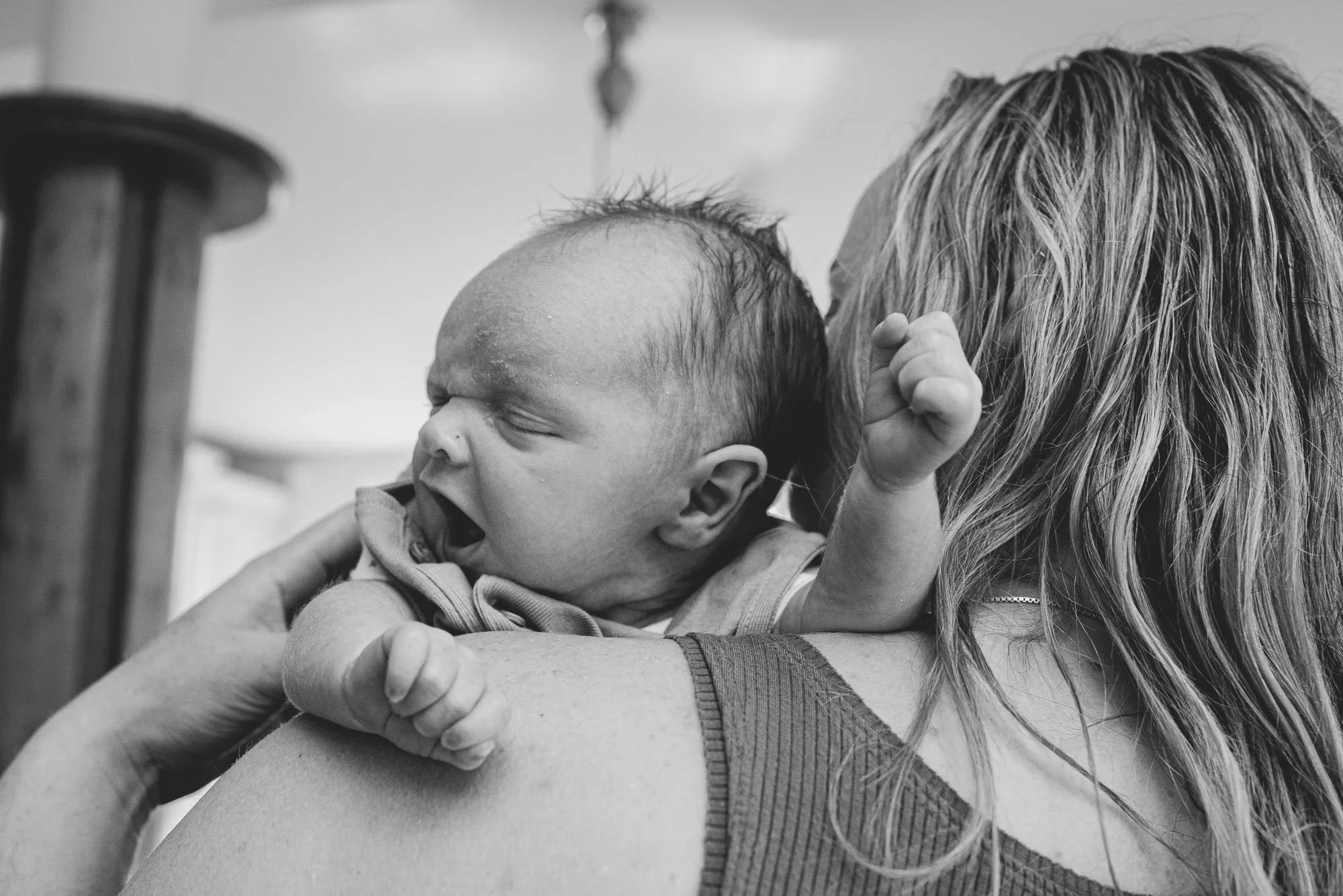 Newborn photographer Wimbledon - natural at-home baby photography SW19. Baby yawning.