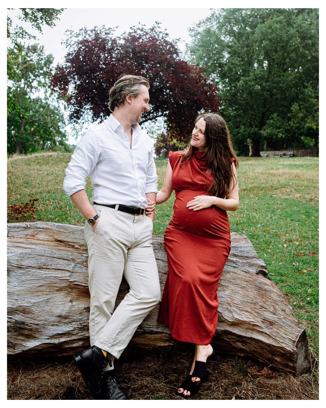 Couple during their maternity photoshoot in Cannizaro Park in Wibledon, South London.
