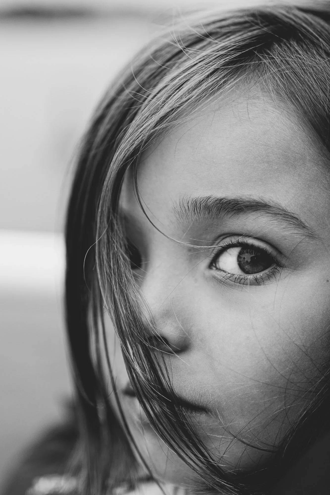 Pricing brochure family photographer Brighton and Hove, East Sussex. Fine Art Portrait of a girl in black and white image.