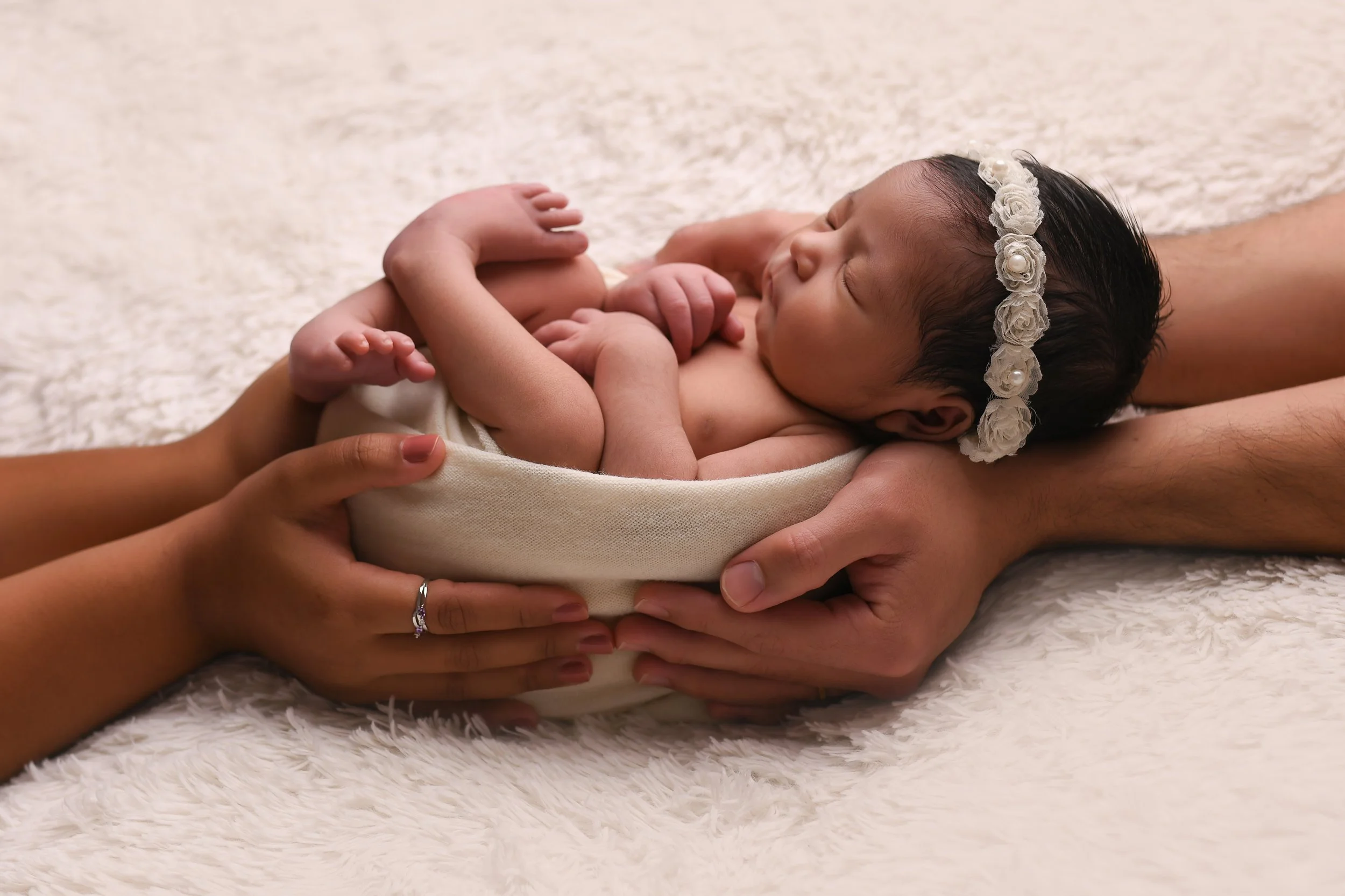 wrapped and held by parents in their hands, you really get a feel for how tiny this baby is and in years to come you will see just how they have grown