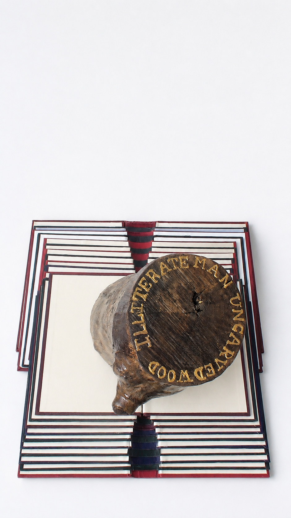 ILLITERATE MAN UNCARVED WOOD
2010
Handcrafted wood log, gold leaf, vintage hardbacks, 
50 x 60 x 40 cm