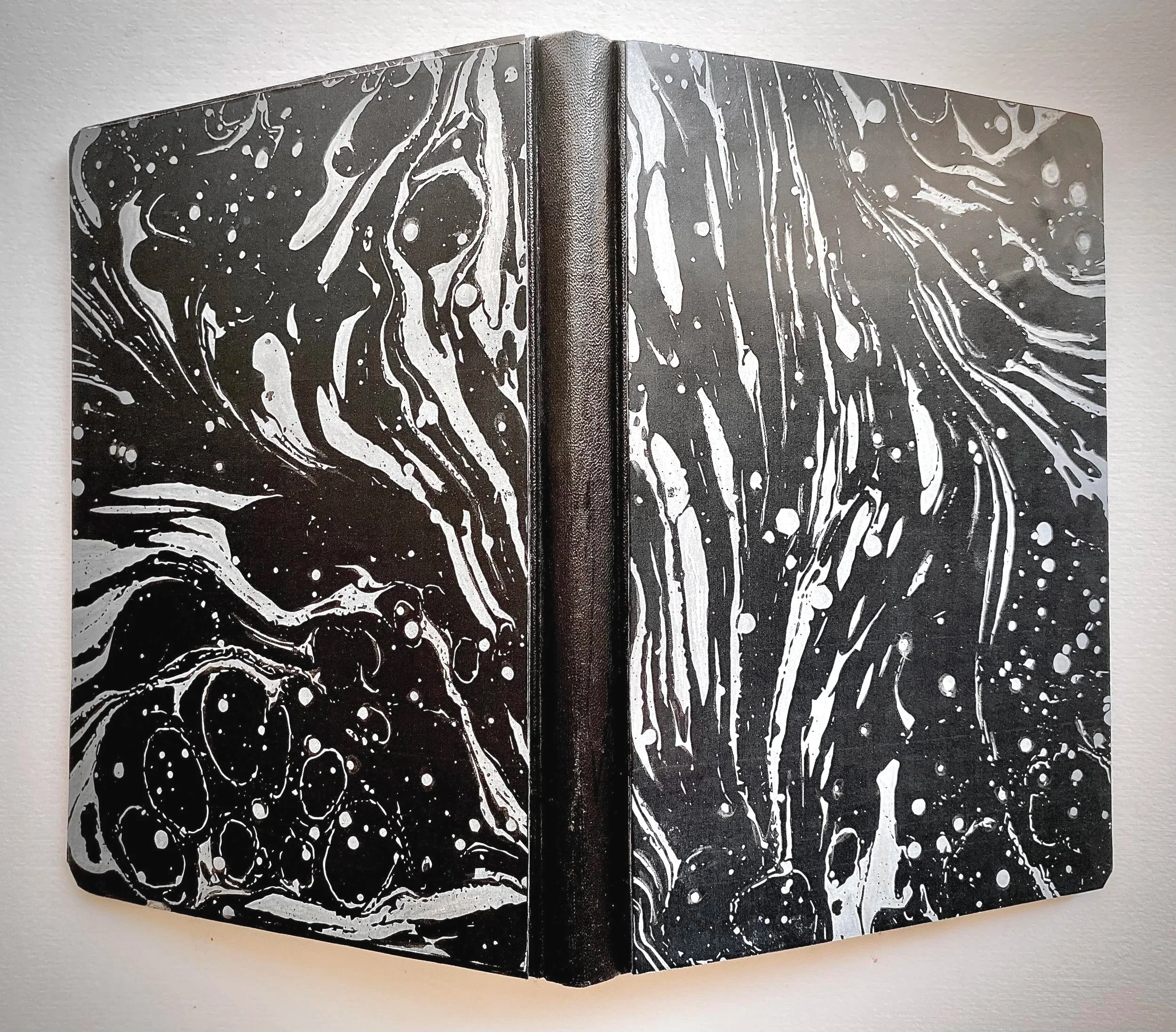 Marble Versus Marbling, June 2026
Unique Artist’ Book , Hand bound book, 33 coloured digital prints of marble spheres & paper marbling, leather , 25 x 18 x 3 cm