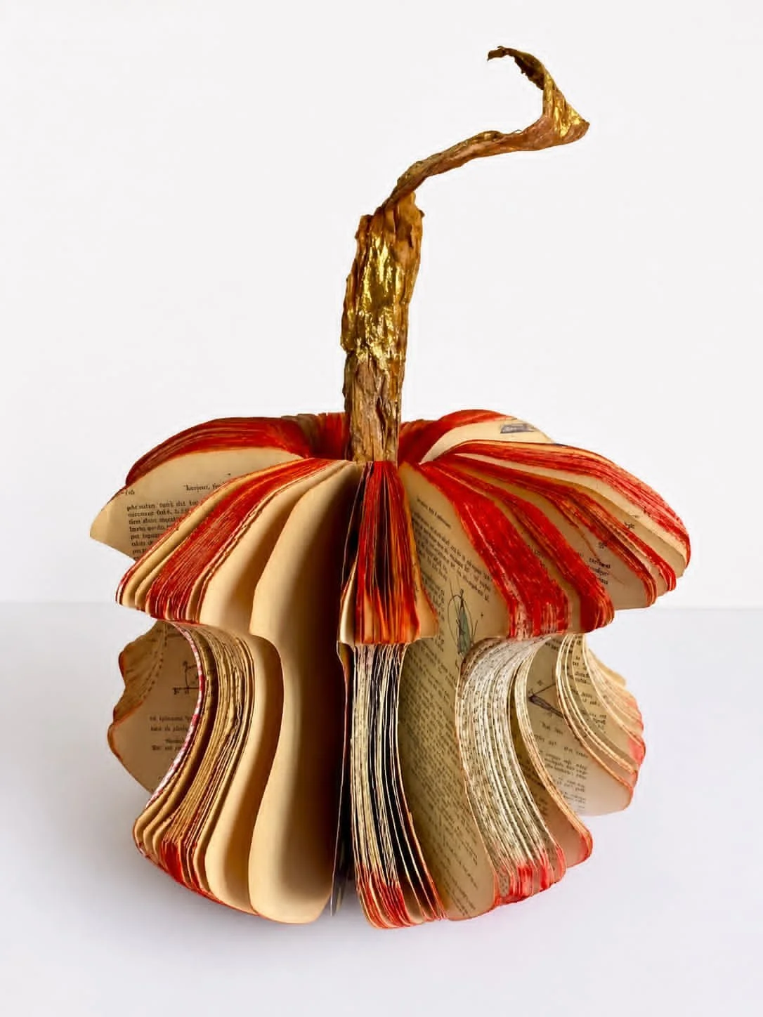 The Apple Squircle
2026
Handcrafted and altered geometry books from the artist’s family collection, pastel powder, marbled papers, wood, natural leaf, and gold leaf.
50 cm high × 40 cm diameter.