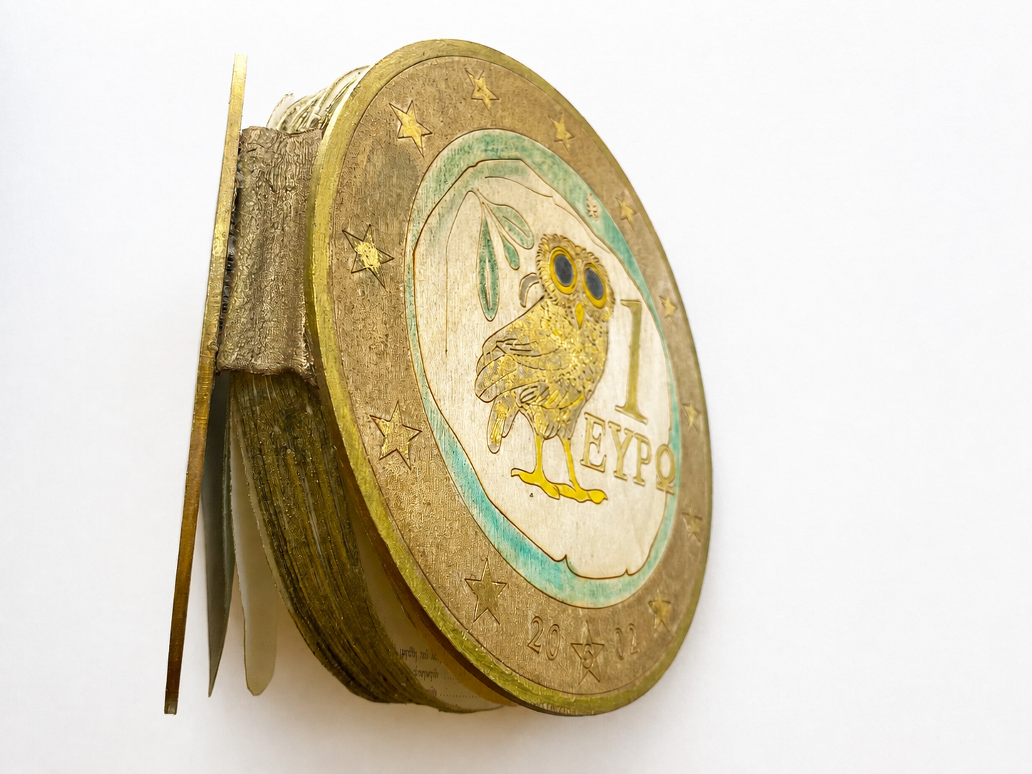 EURO-VOLVELLE, 2019, Hand cut publication national bank of greece, wood, laser-cut cover, gold leaf, 10 cm high x 40 cm diameter 