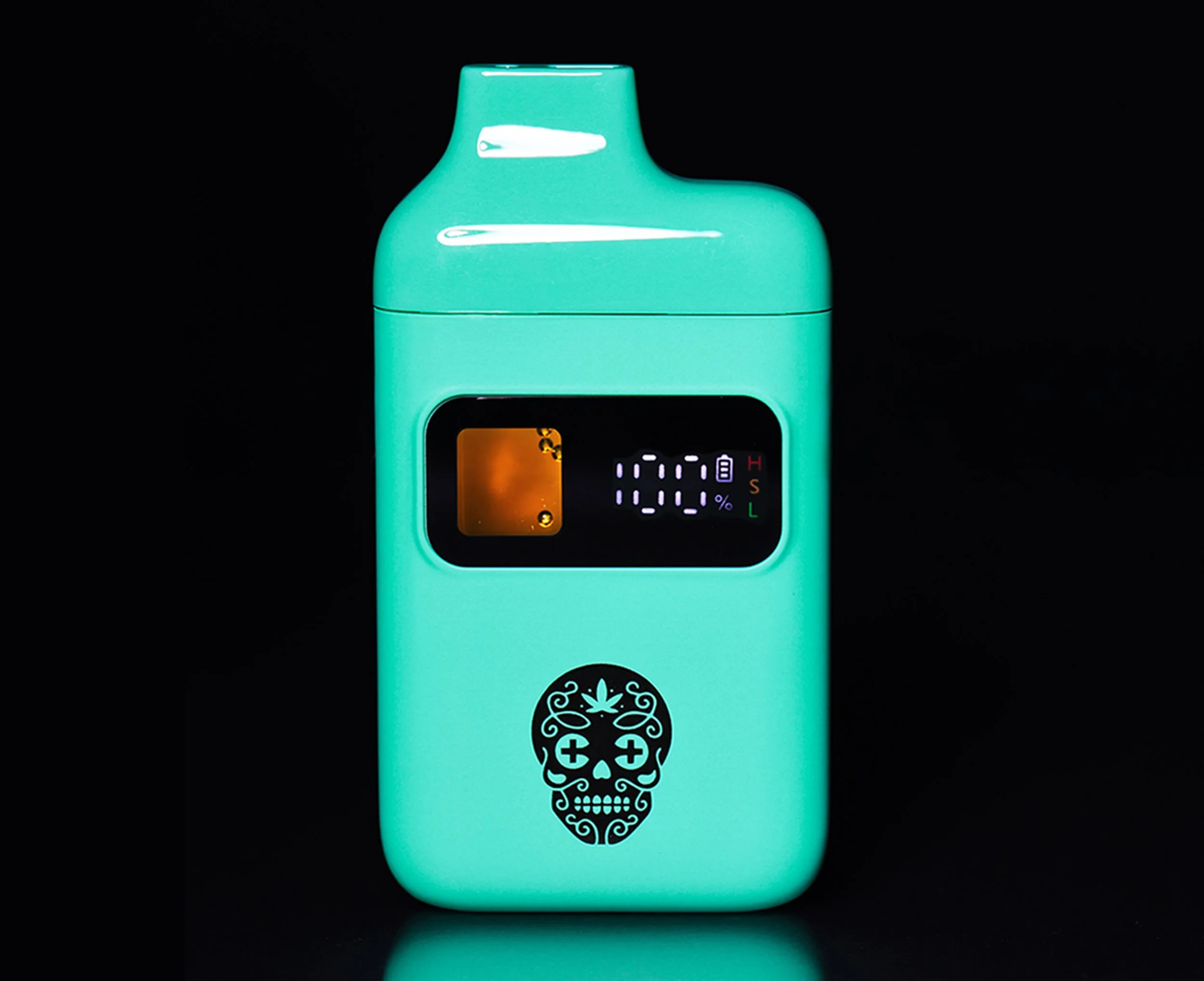 The new Canamo AIO2 Vape, teal-colored device with a digital display screen and a black skull design with floral patterns, set against a black background.