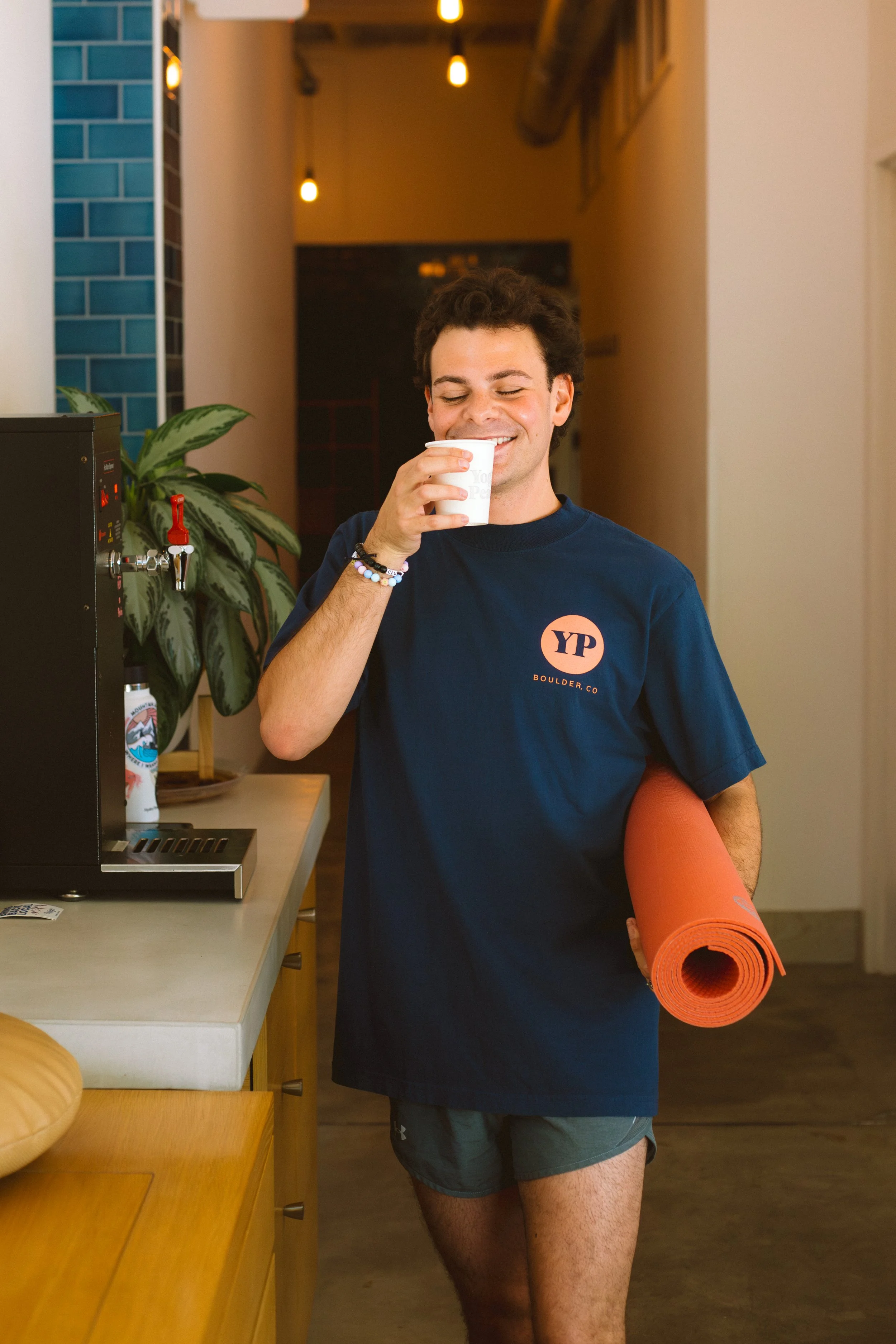 Someone grabbing tea at the tea station