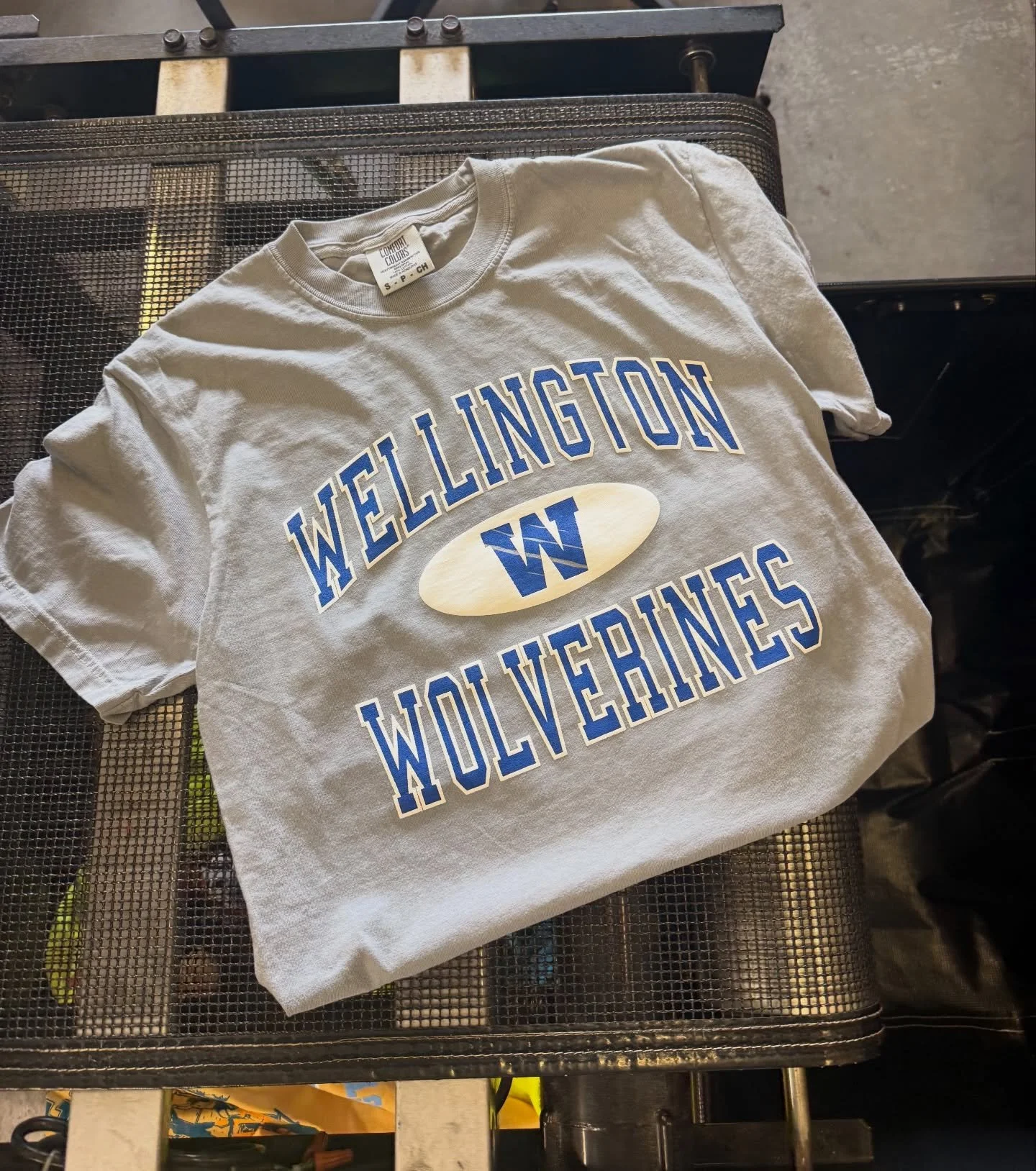 Straight off the dryer and one step closer to the school store. Every shirt is printed, cured, inspected, and folded before it reaches the shelves, ensuring students and families receive a quality product that&rsquo;s built to last throughout the sch