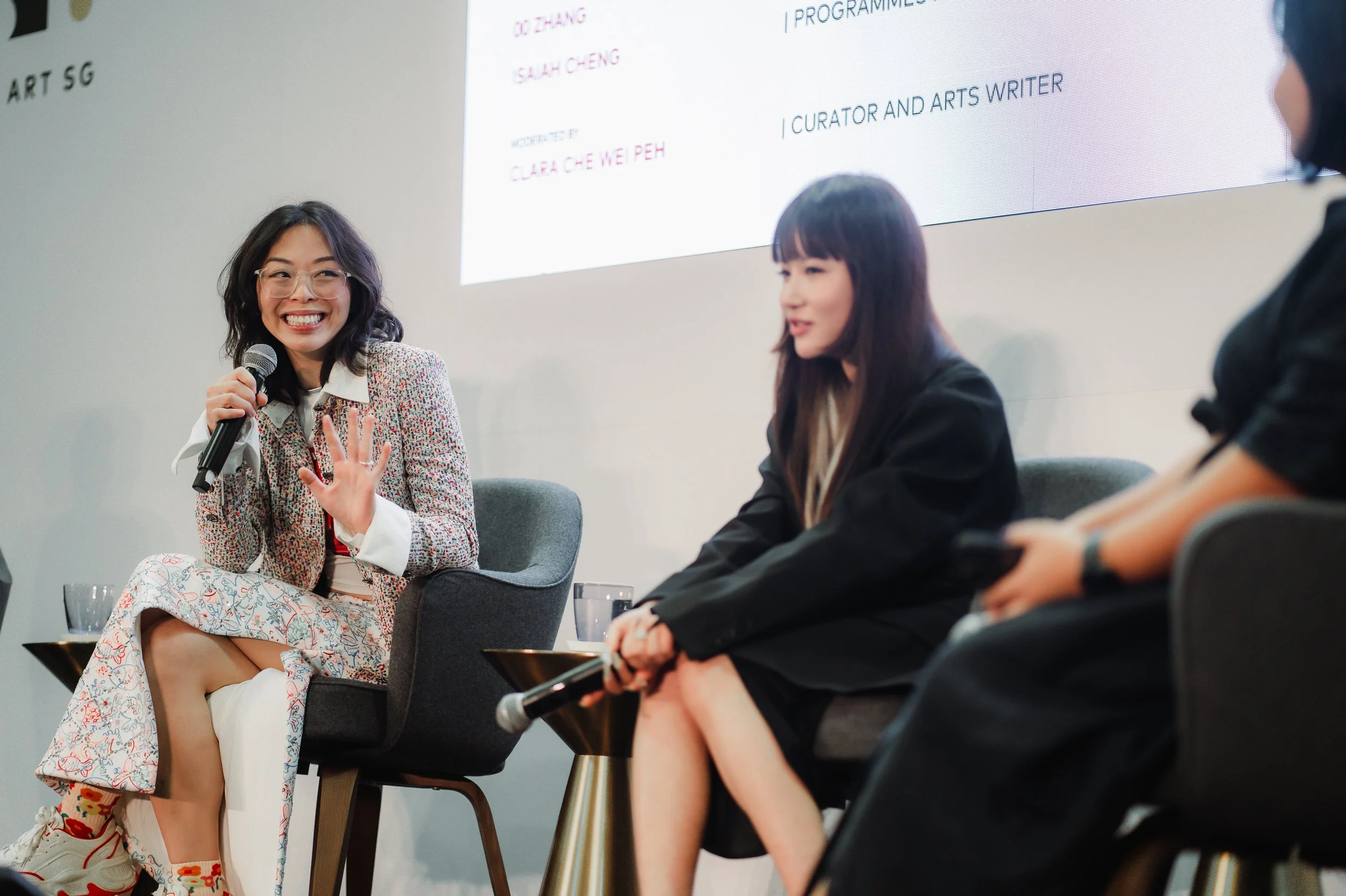 Shavonne Wong speaking on the “Bodies on Screens” panel at ART SG 2025, discussing presence, identity, and AI with fellow artists and curators.