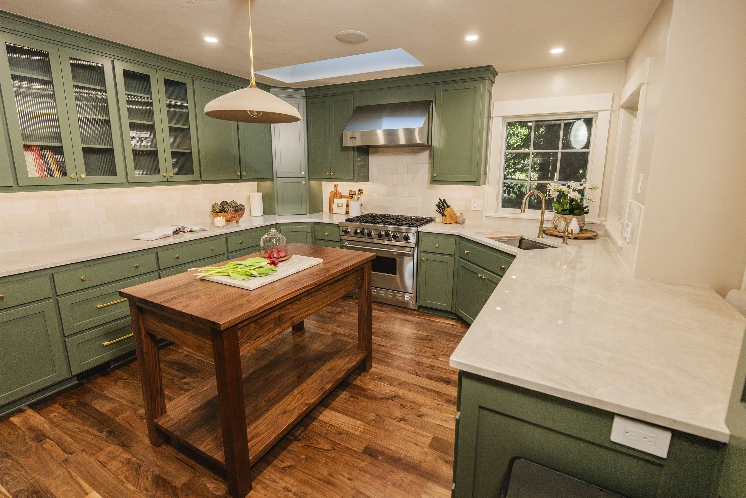 QUARTZITE COUNTERS WITH CUSTOM ISLAND AND TILE BACKSPLASH