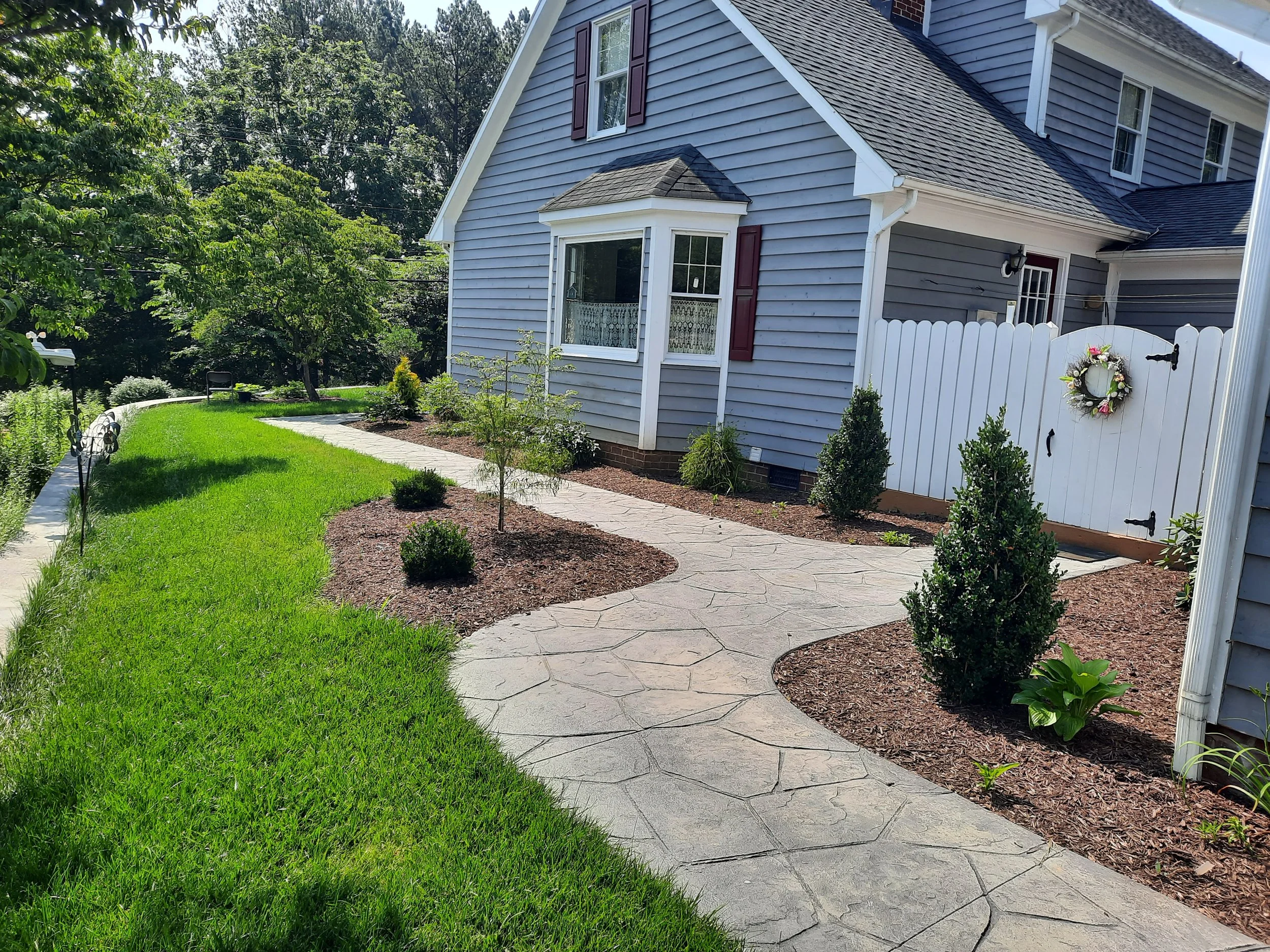 Flagstone sidewalk with landscape.jpg